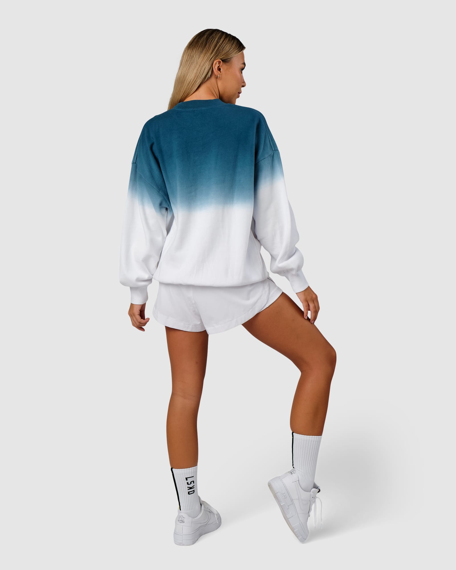 Model wearing Unisex Gradient Sweater - Atlantic-White