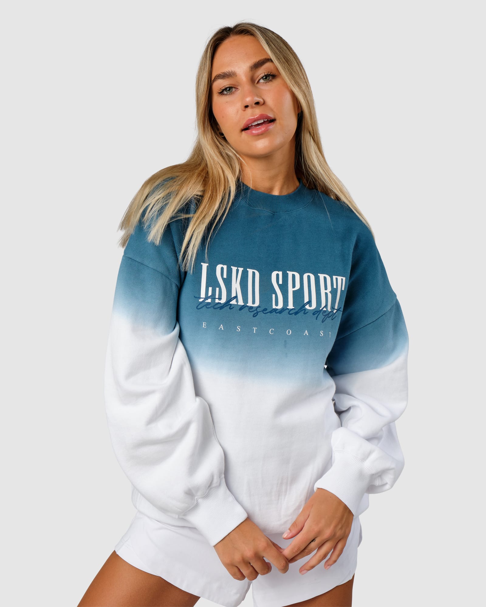 Model wearing Unisex Gradient Sweater - Atlantic-White