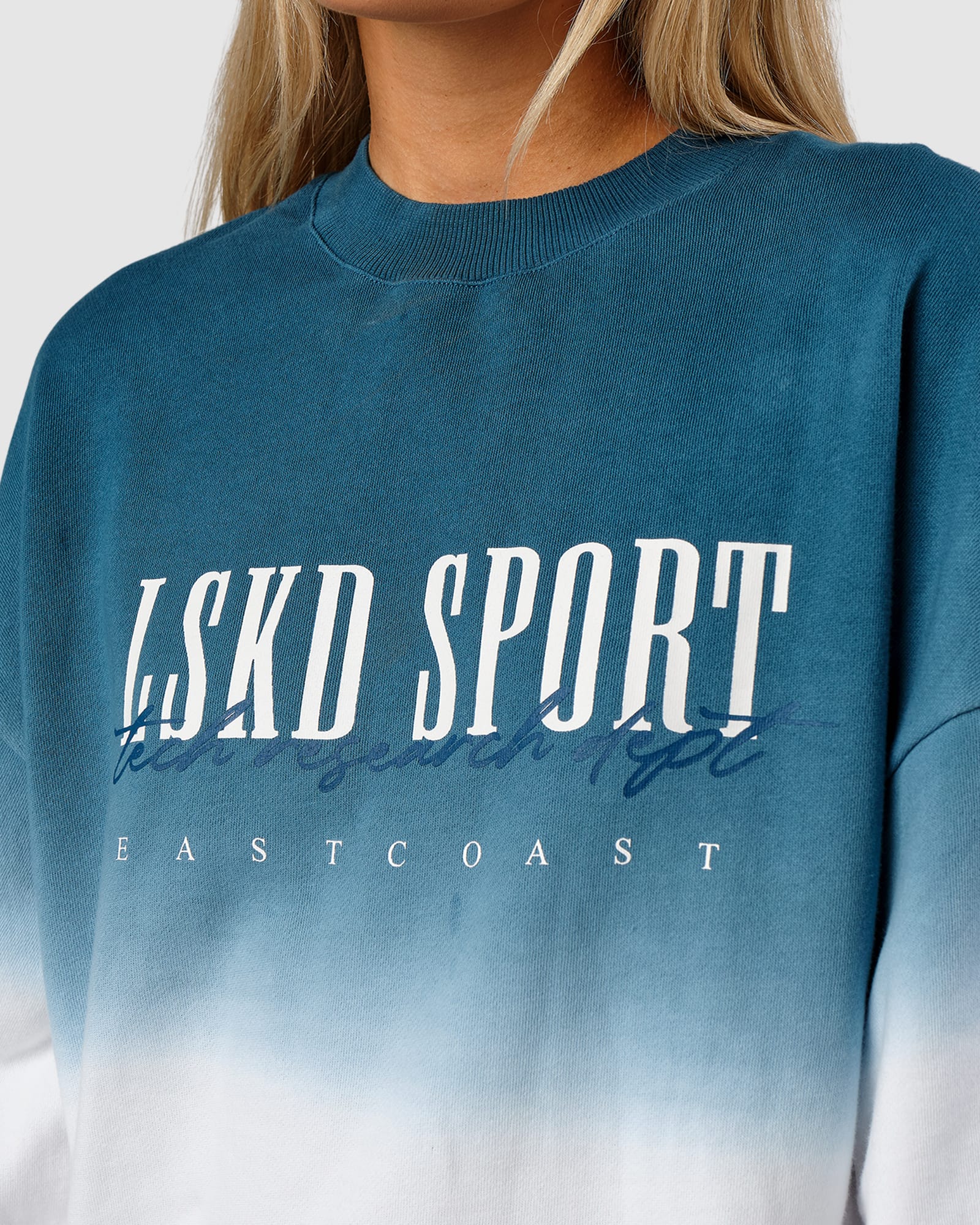 Model wearing Unisex Gradient Sweater - Atlantic-White