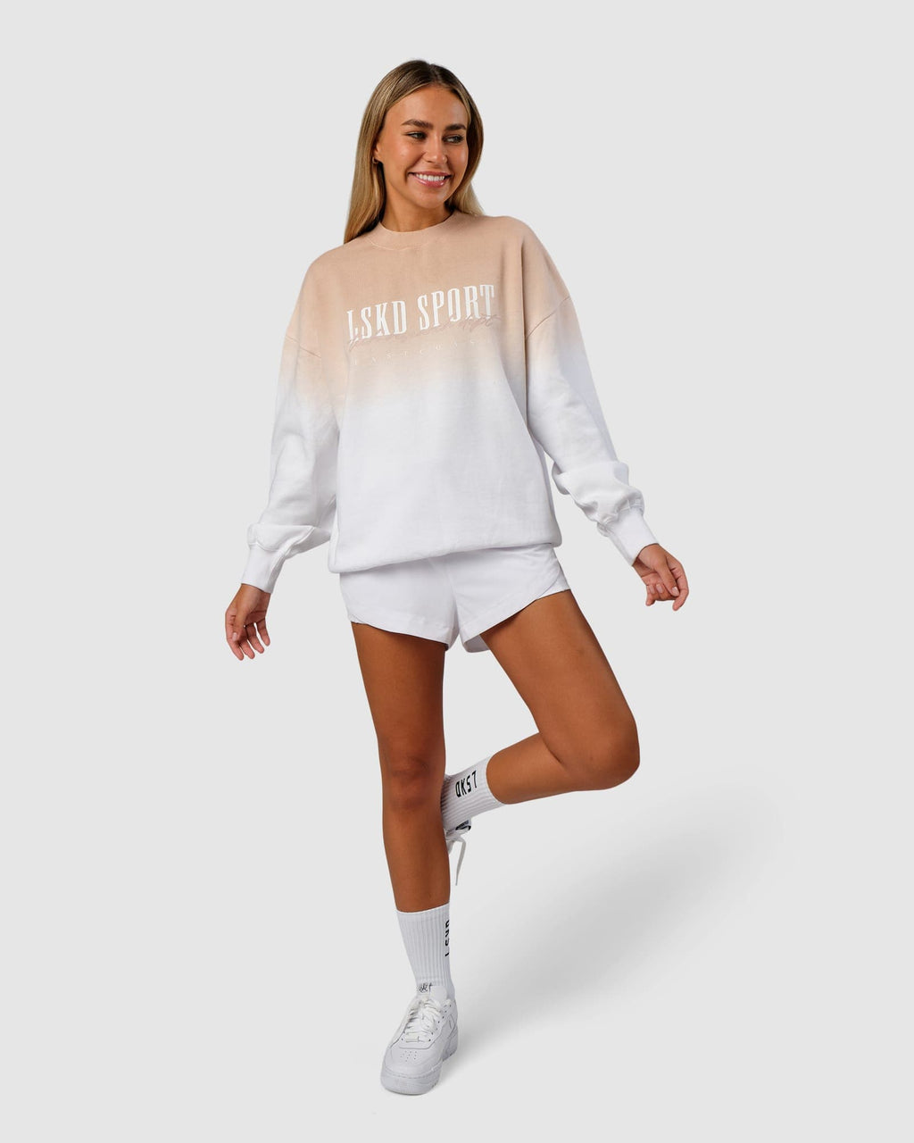 Model wearing Unisex Gradient Sweater - Nude-White