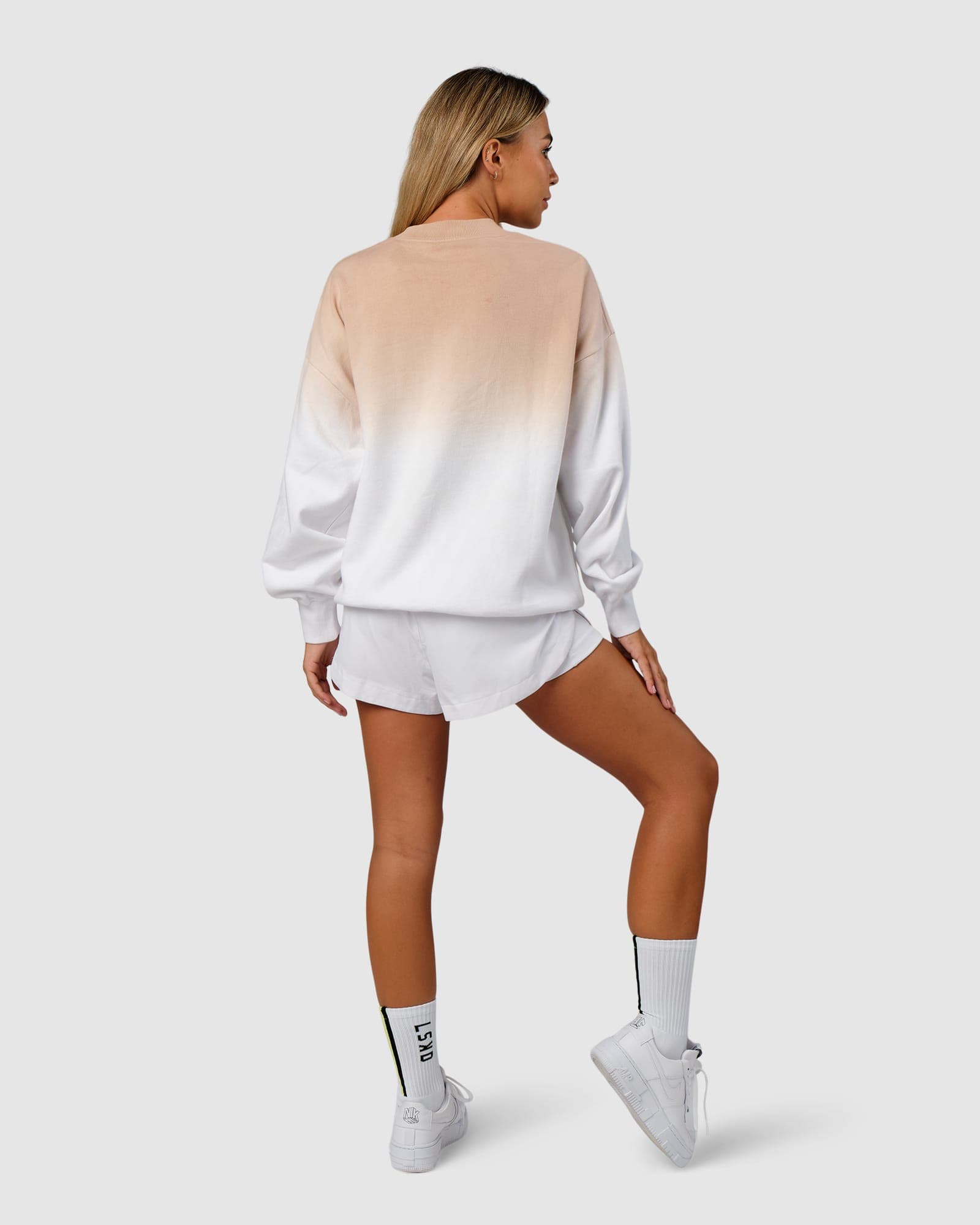 Model wearing Unisex Gradient Sweater - Nude-White