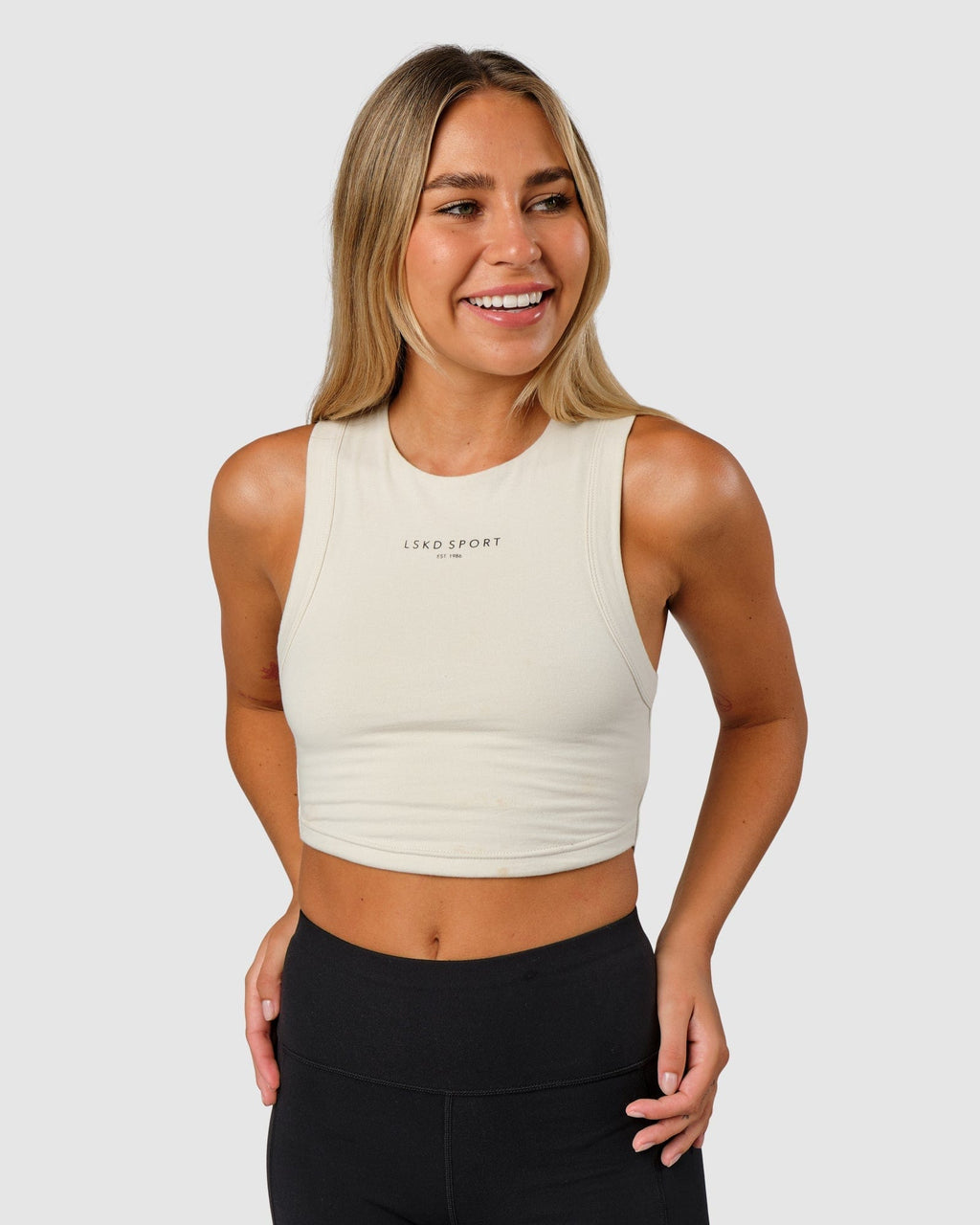 Model wearing Run Tank - Bone