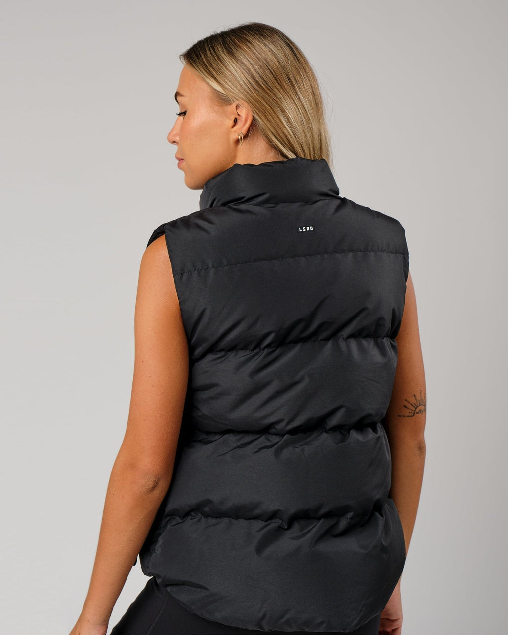 Model wearing Essential Puffer Vest - Black