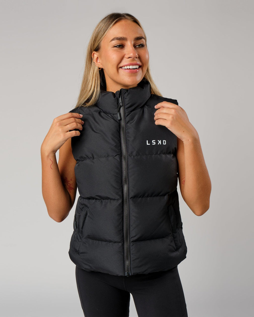 Model wearing Essential Puffer Vest - Black