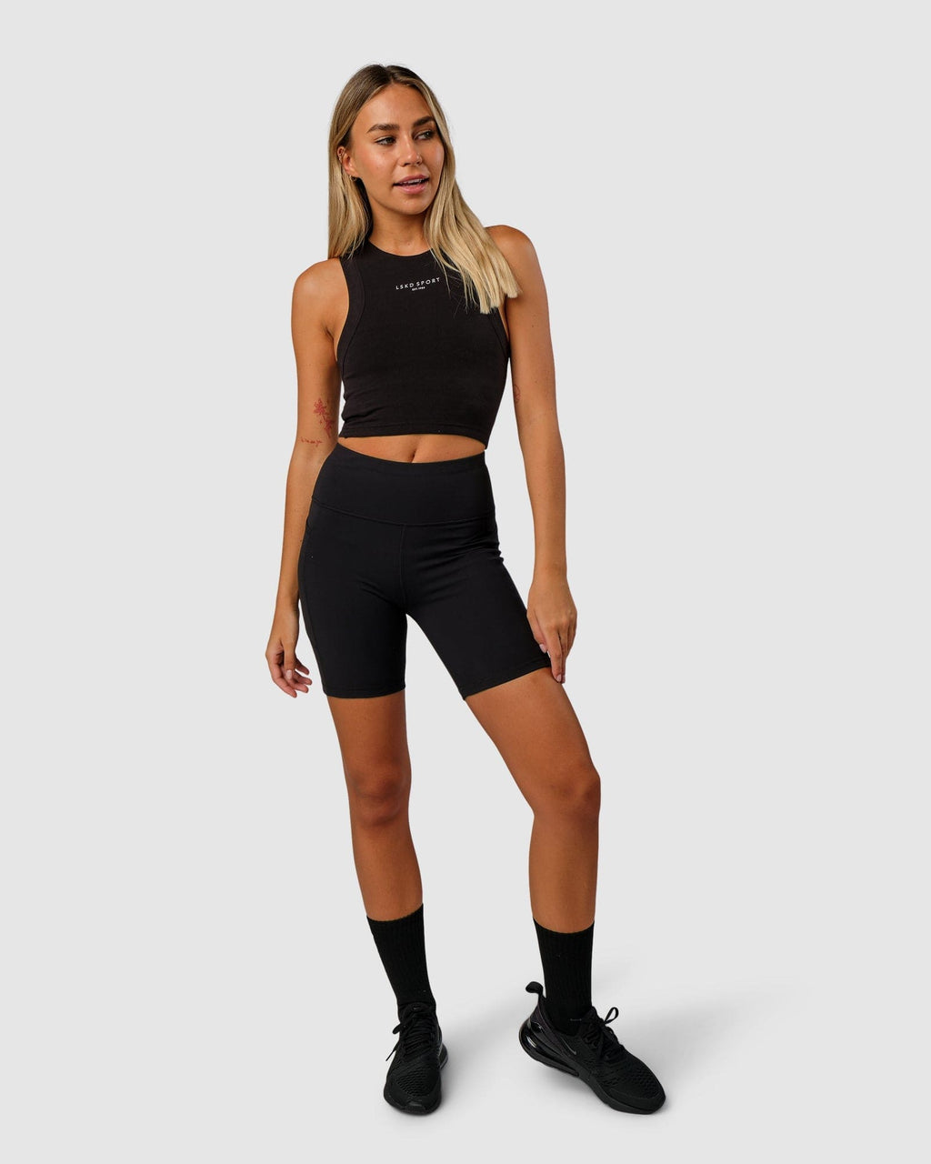 Model wearing Run Tank - Black