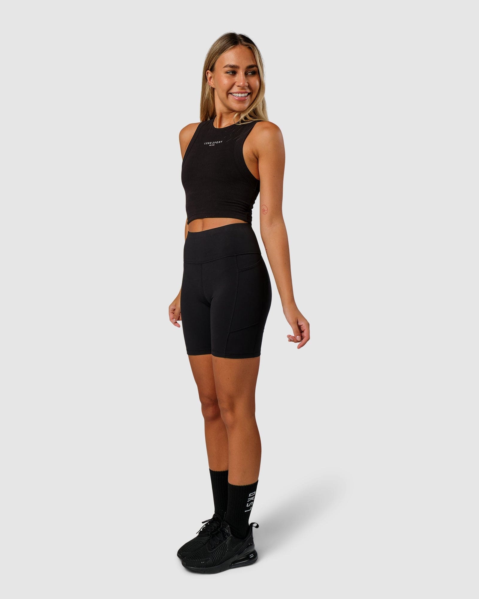 Model wearing Run Tank - Black