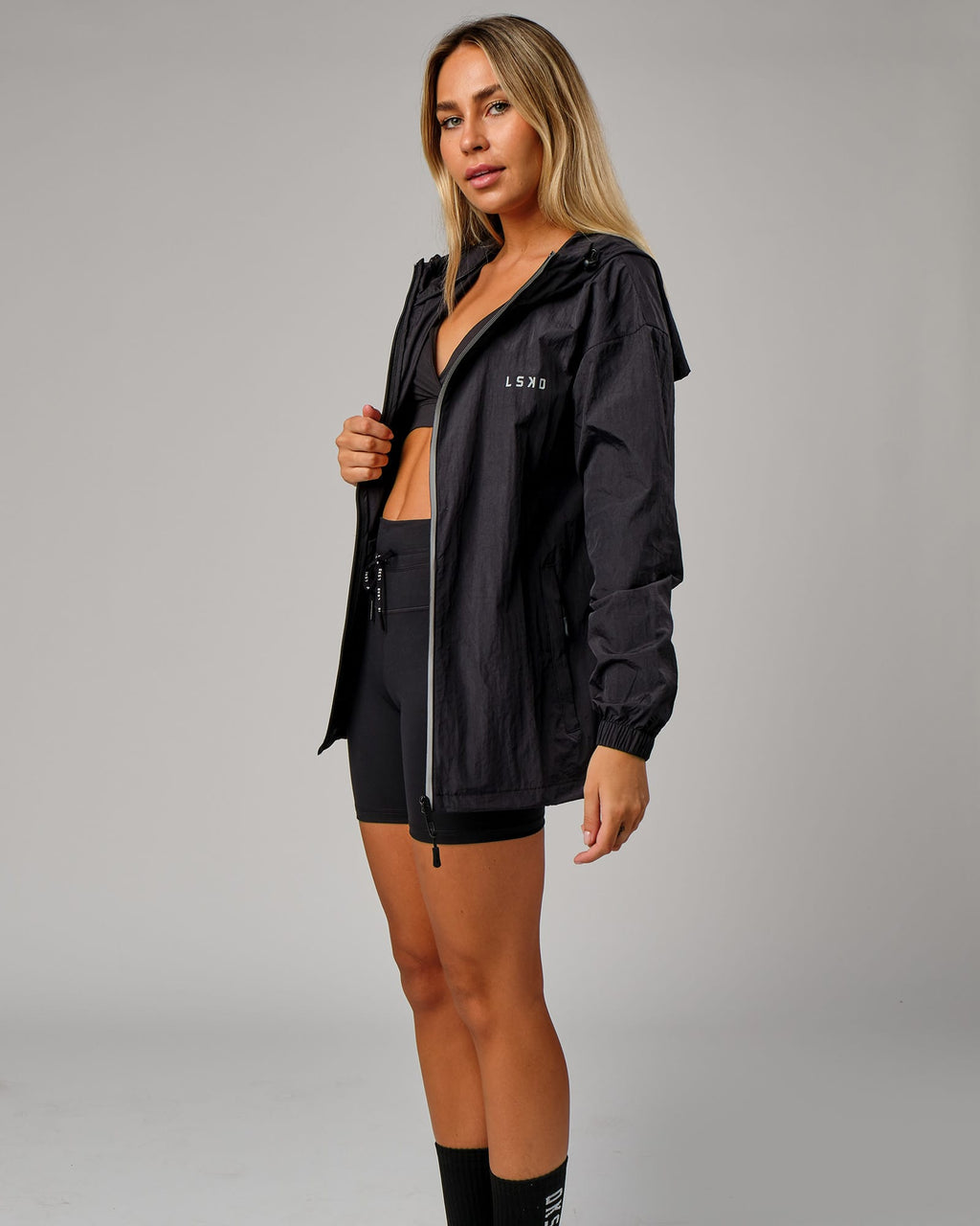 Model wearing Unisex Run Club Track Jacket - Black-Reflective