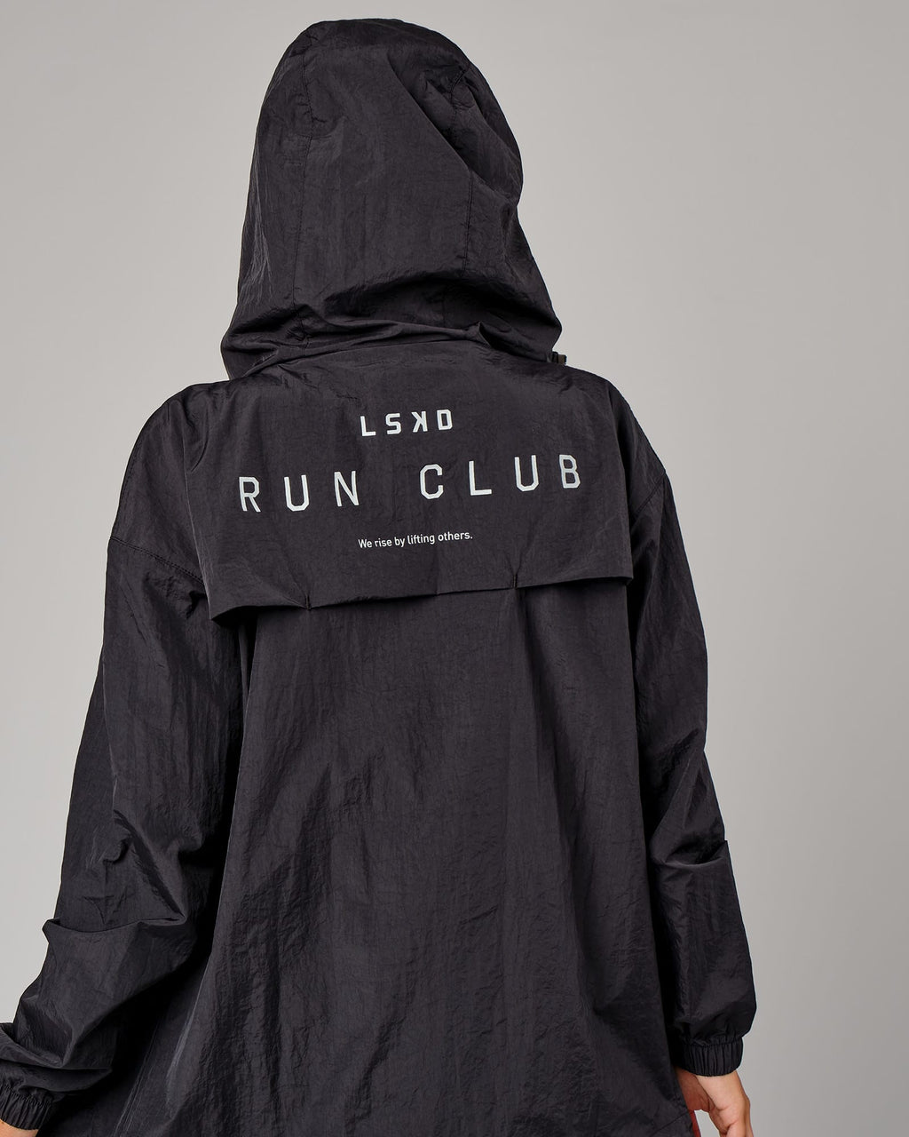 Model wearing Unisex Run Club Track Jacket - Black-Reflective