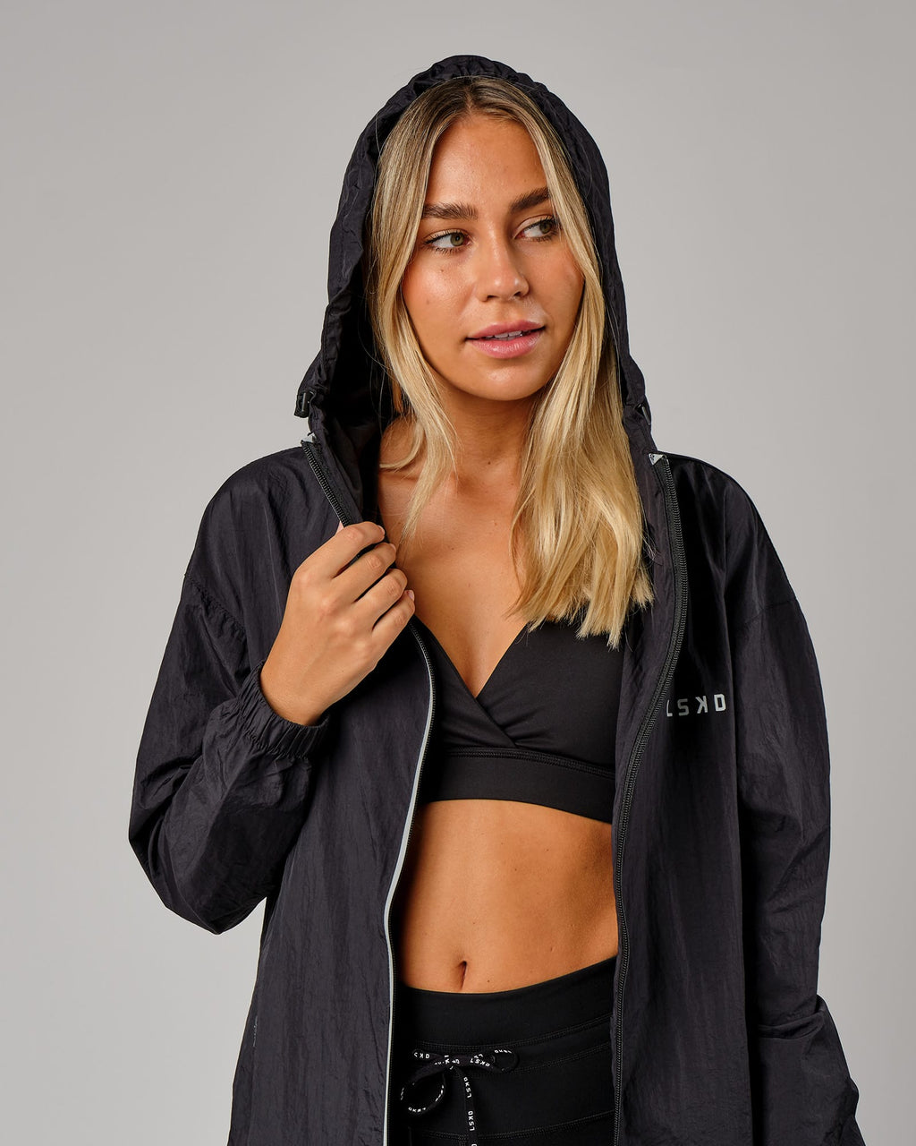 Model wearing Unisex Run Club Track Jacket - Black-Reflective