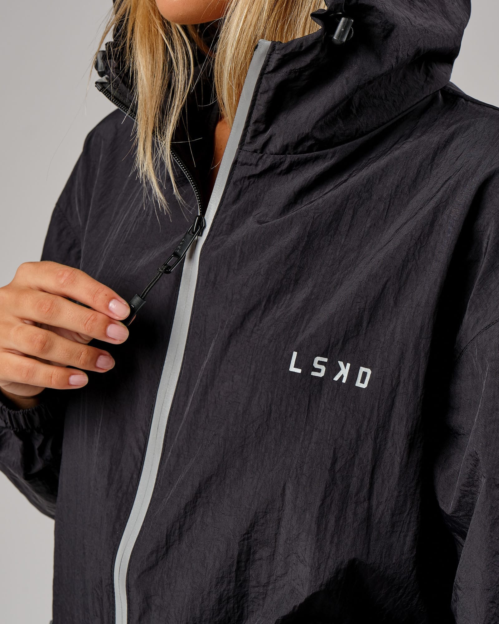 Model wearing Unisex Run Club Track Jacket - Black-Reflective