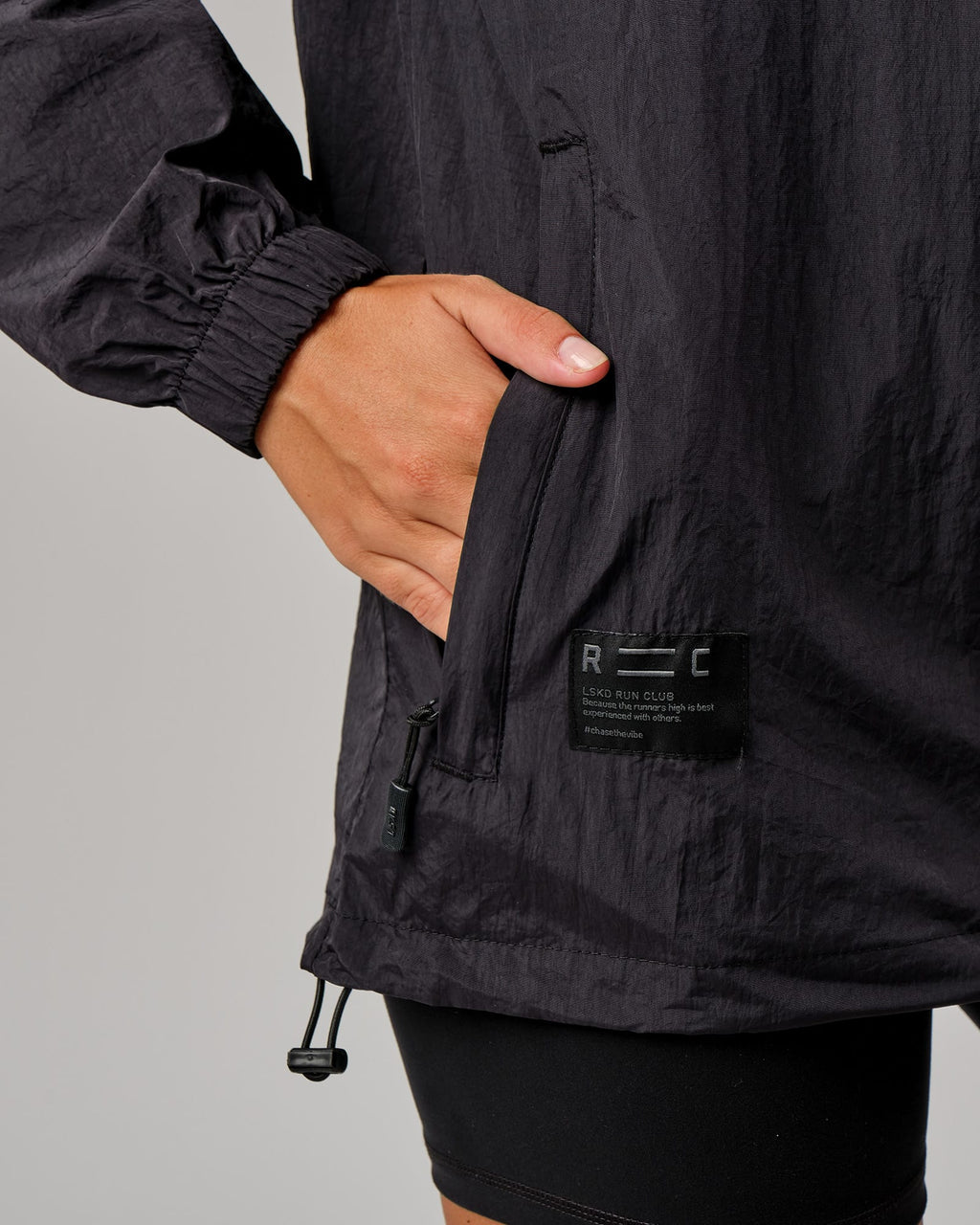 Model wearing Unisex Run Club Track Jacket - Black-Reflective