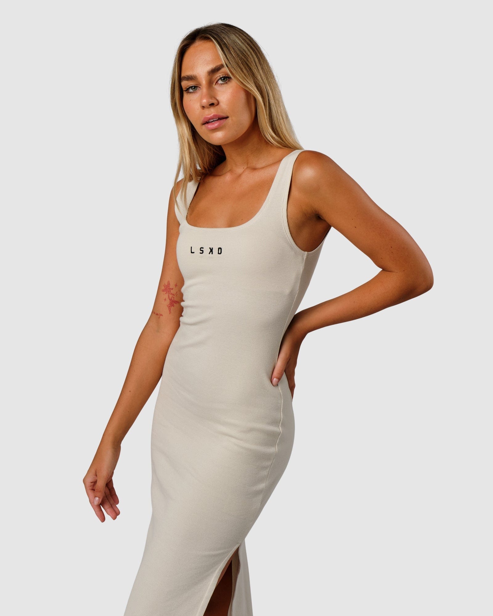 Model wearing Ava Ribbed Tank Dress - Bone