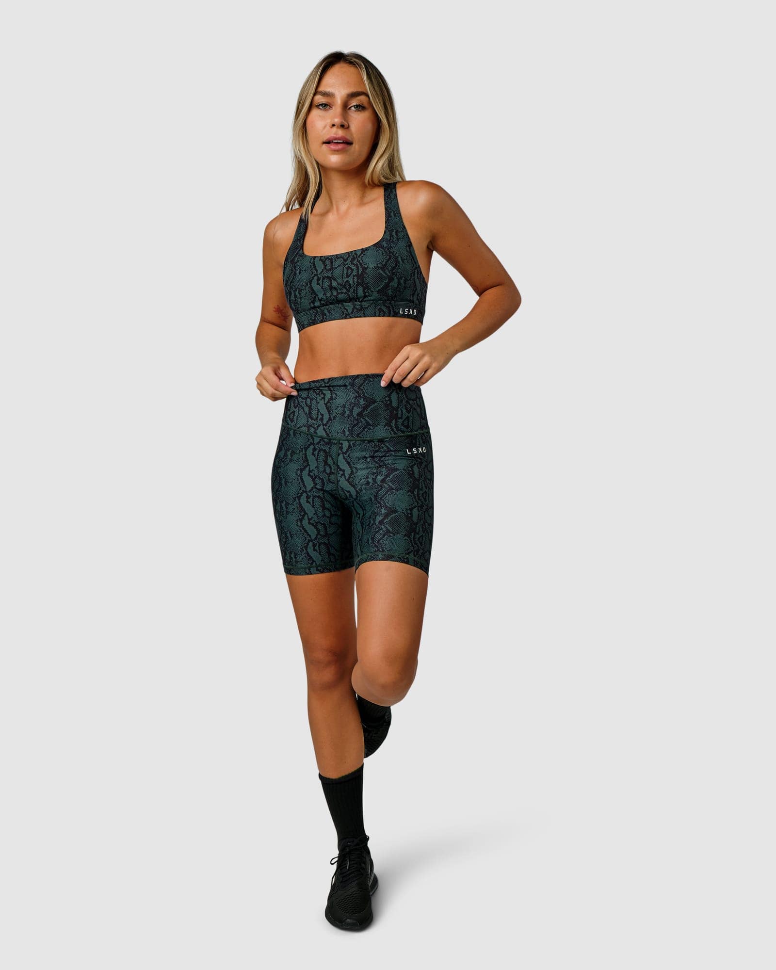 Model wearing Base Sports Bra - Forest Snakeskin