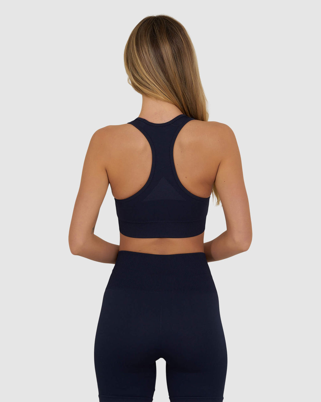 Model wearing Limitless Seamless Sports Bra - Navy