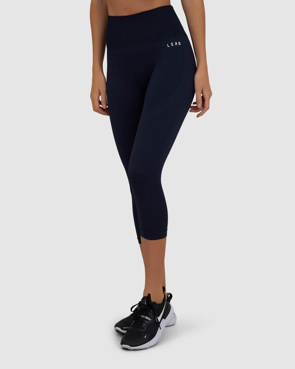 Model wearing Limitless Seamless 3/4 Length Tight - Navy