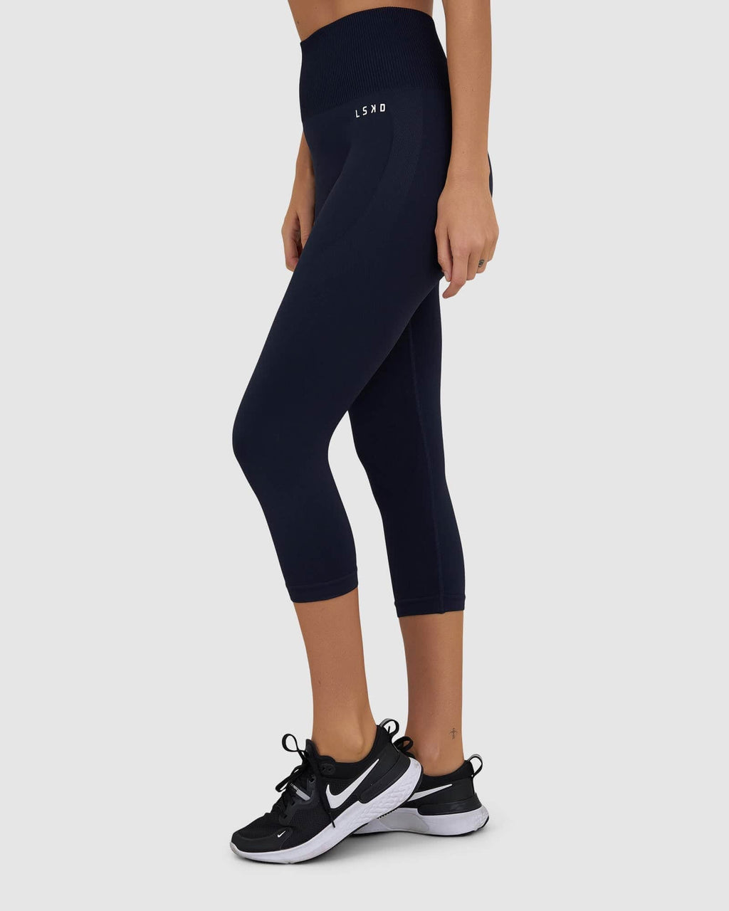 Model wearing Limitless Seamless 3/4 Length Tight - Navy