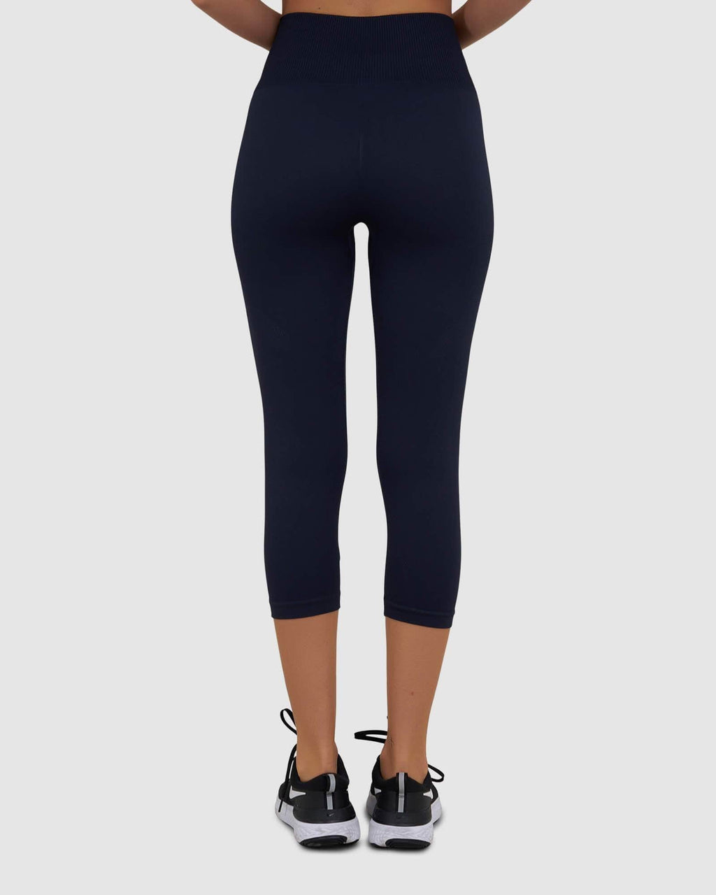 Model wearing Limitless Seamless 3/4 Length Tight - Navy