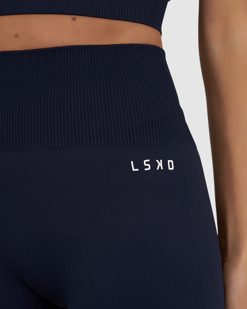 Model wearing Limitless Seamless 3/4 Length Tight - Navy