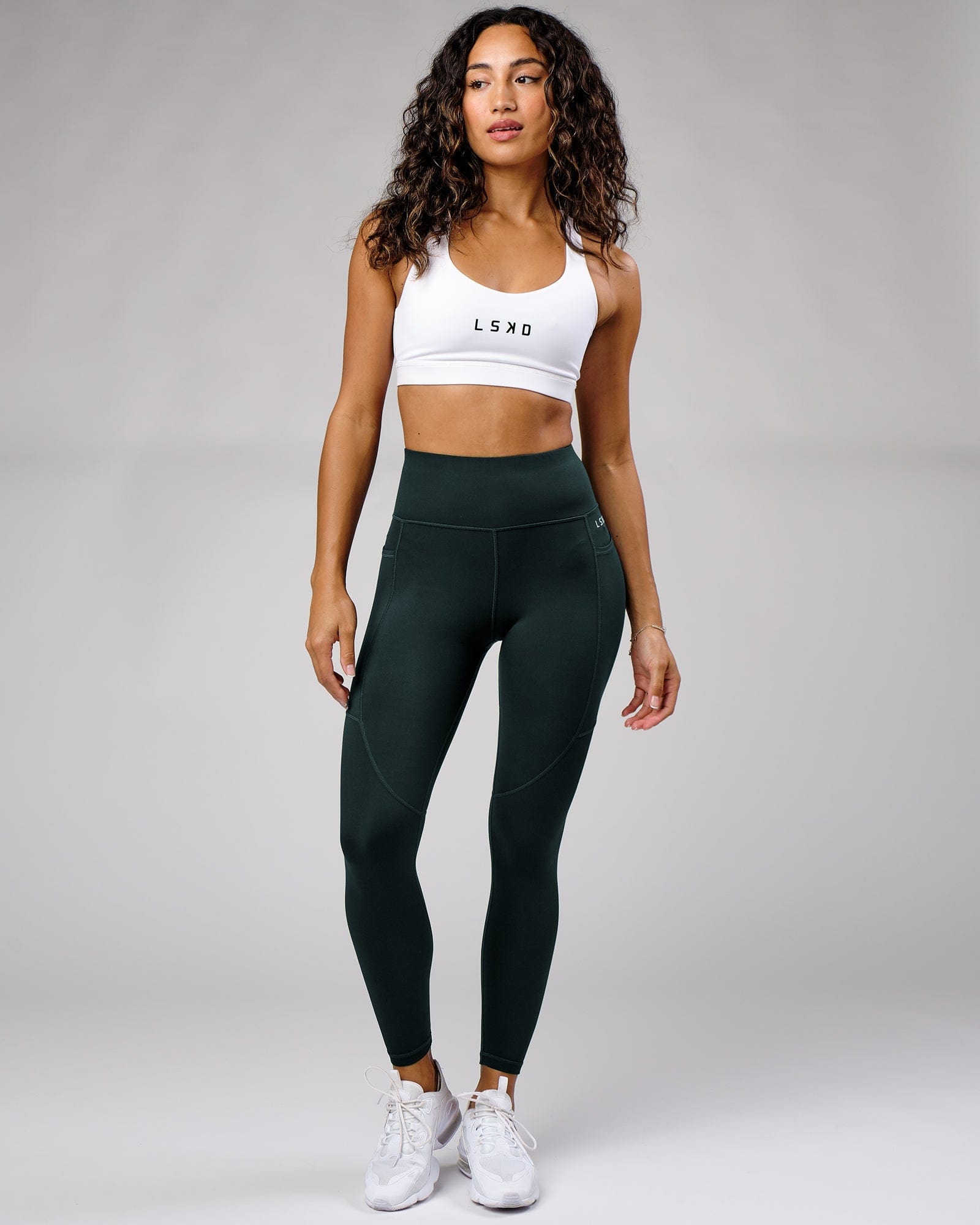 Model wearing Rep Full Length Tight Small Logo - Deep Teal