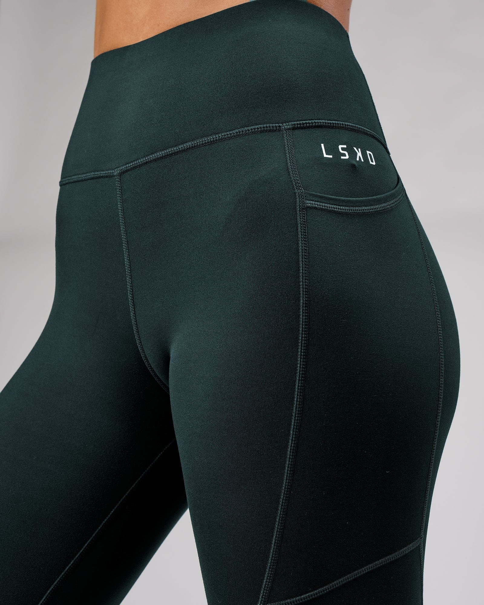 Model wearing Rep Full Length Tight Small Logo - Deep Teal