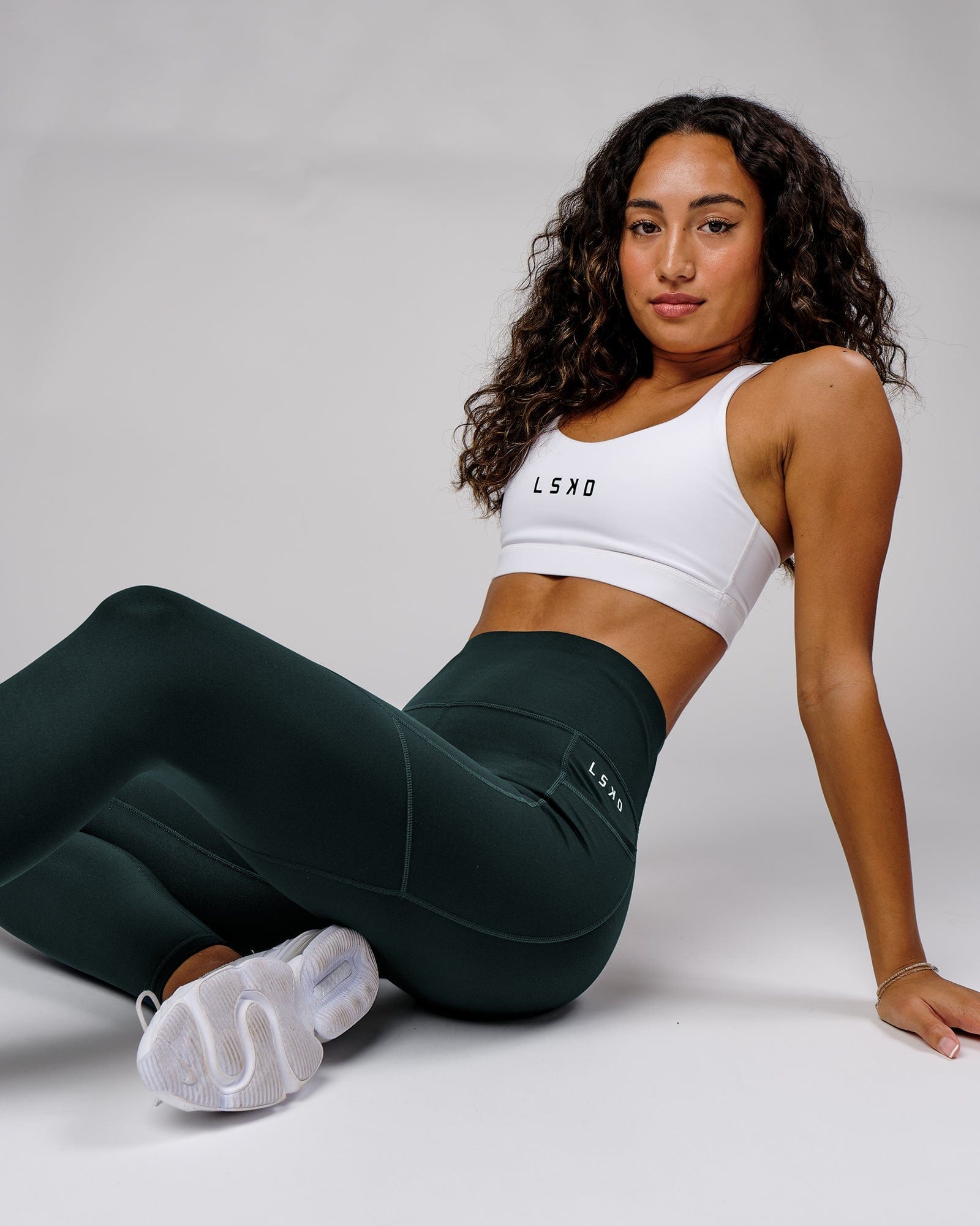 Model wearing Rep Full Length Tight Small Logo - Deep Teal