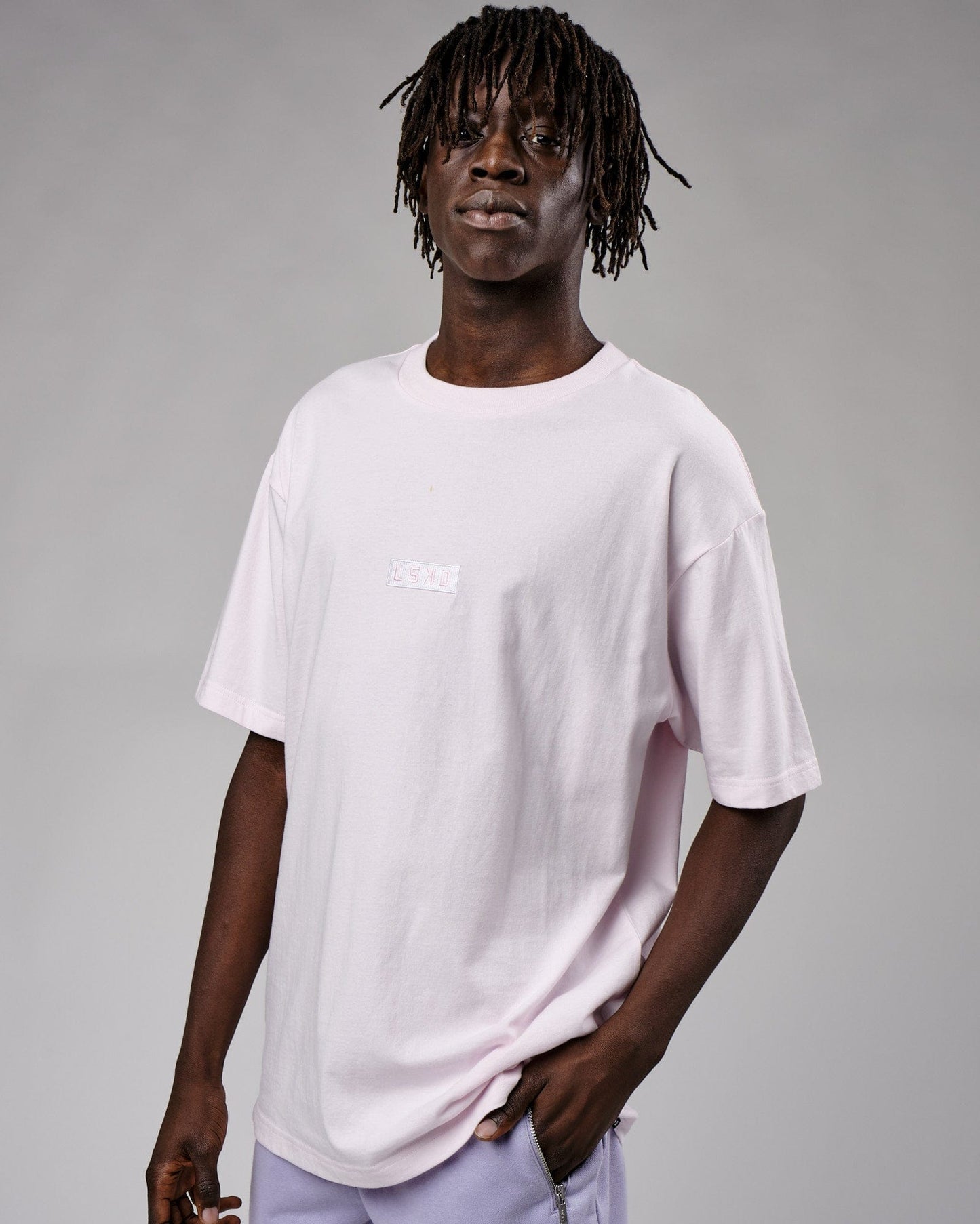 Model wearing Cornerstone Tee Oversize - Orchid Ice