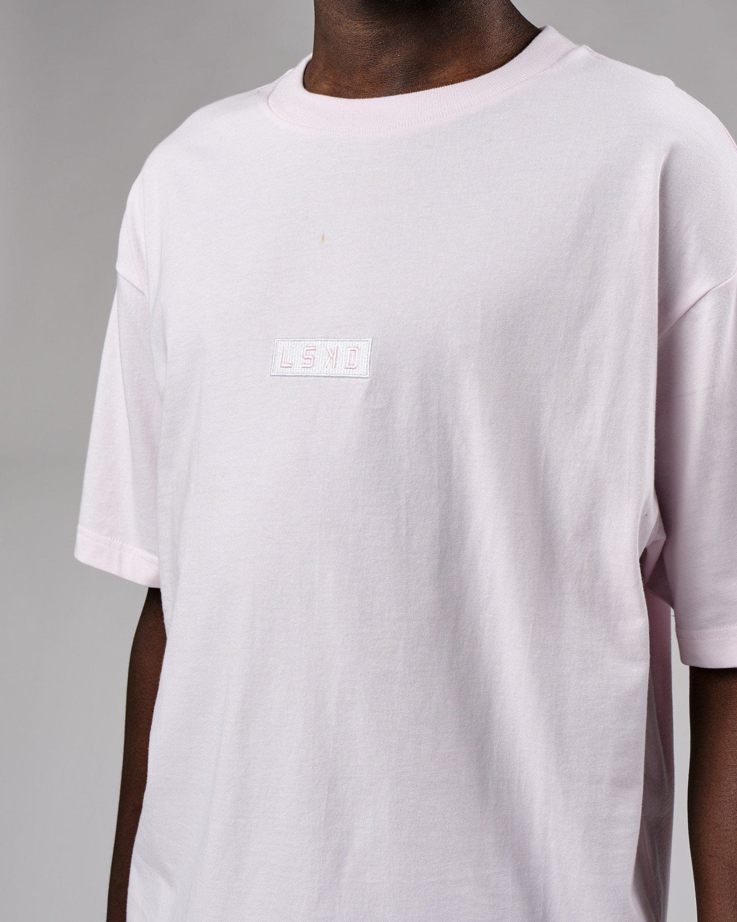 Model wearing Cornerstone Tee Oversize - Orchid Ice