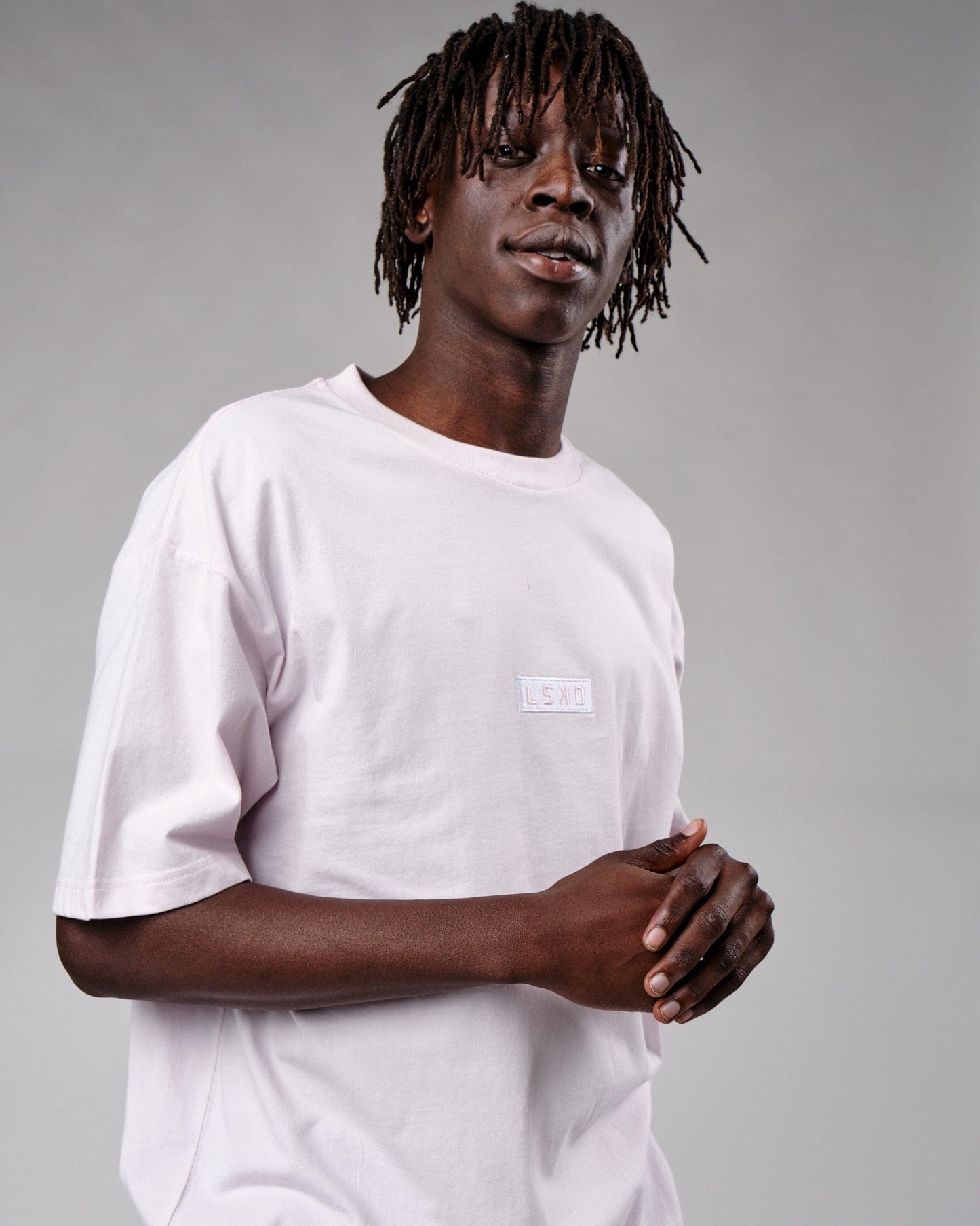 Model wearing Cornerstone Tee Oversize - Orchid Ice