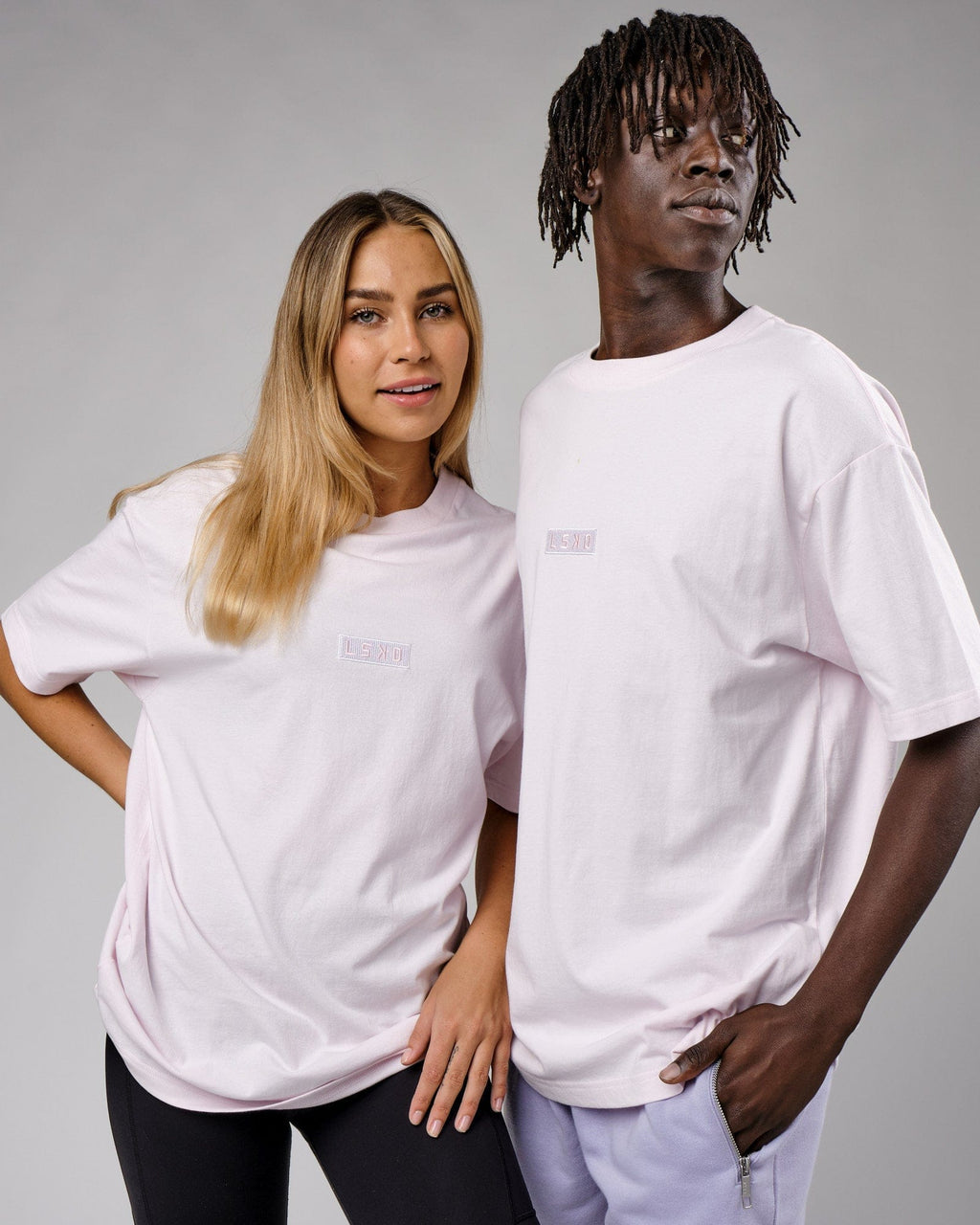 Model wearing Unisex Cornerstone Tee Oversize - Orchid Ice