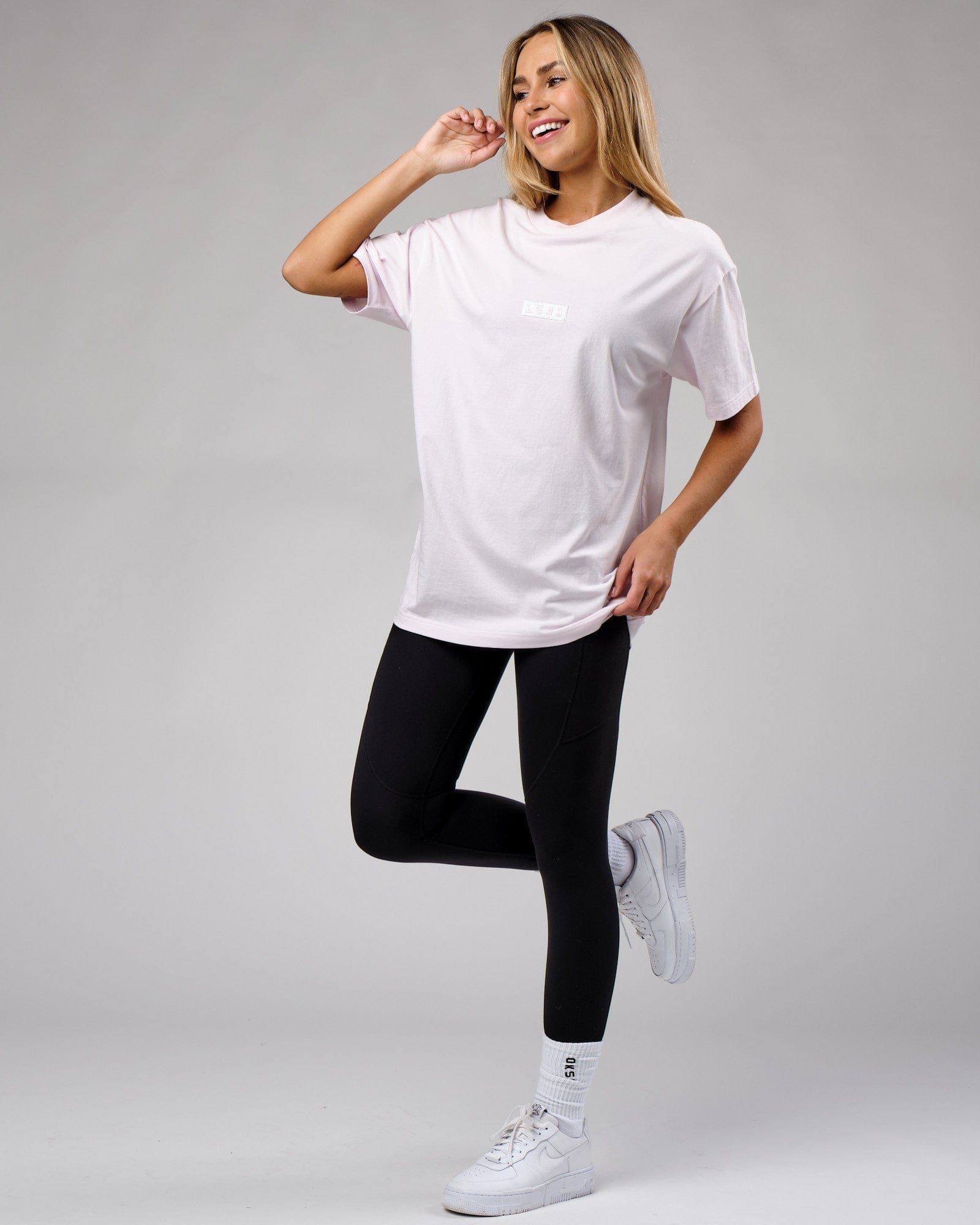 Model wearing Unisex Cornerstone Tee Oversize - Orchid Ice