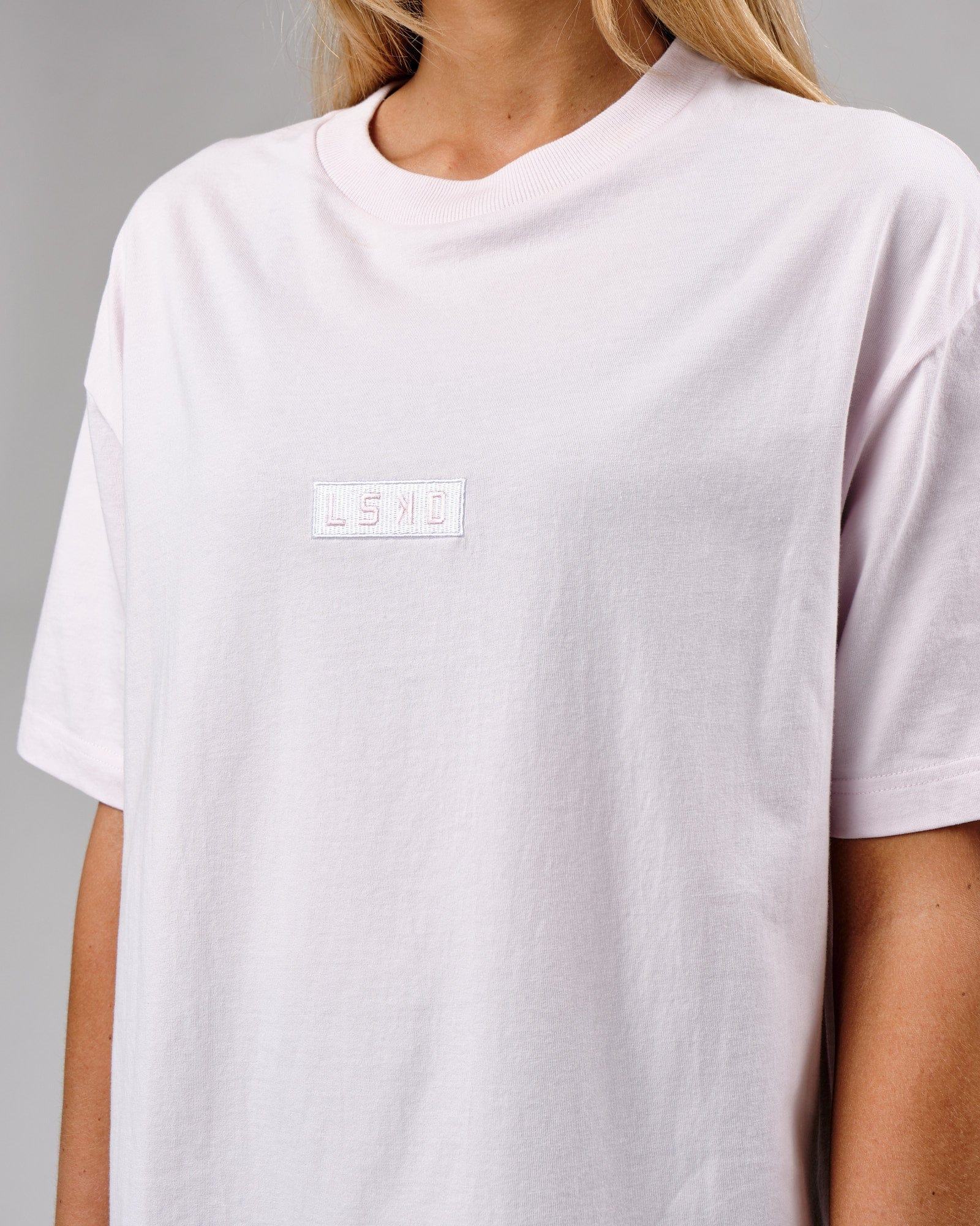 Model wearing Unisex Cornerstone Tee Oversize - Orchid Ice