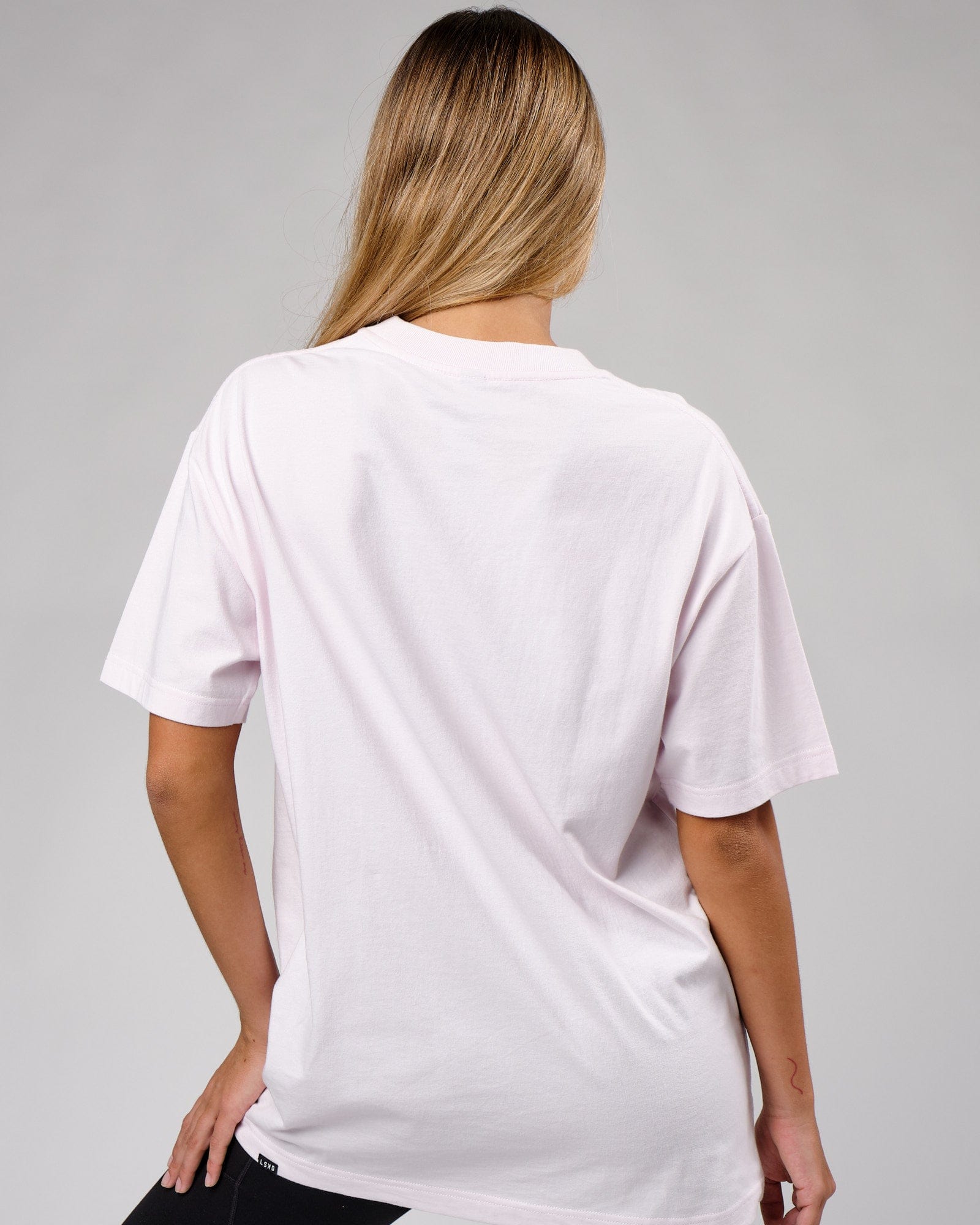 Model wearing Unisex Cornerstone Tee Oversize - Orchid Ice