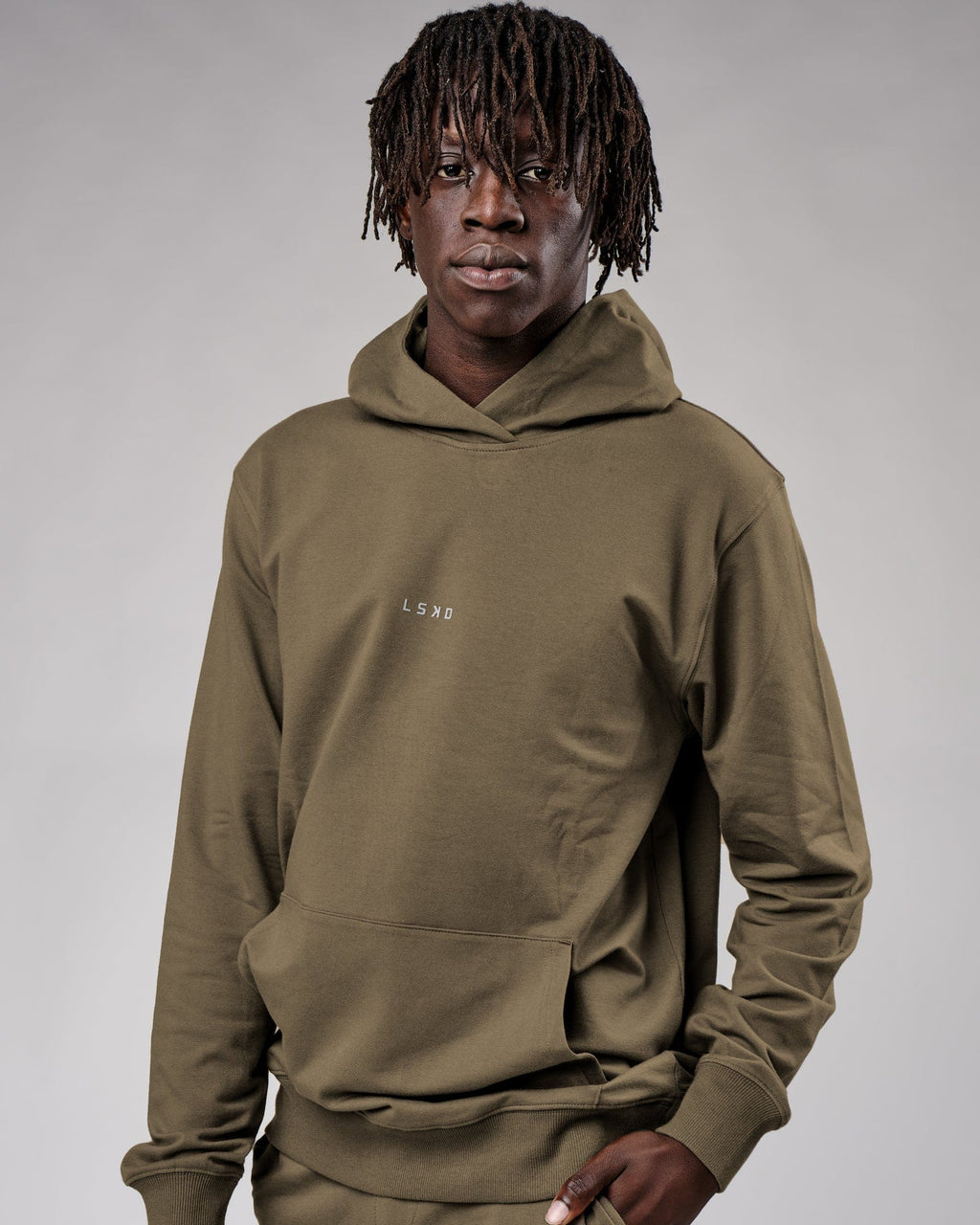 Model wearing Base Hoodie - Walnut Grey