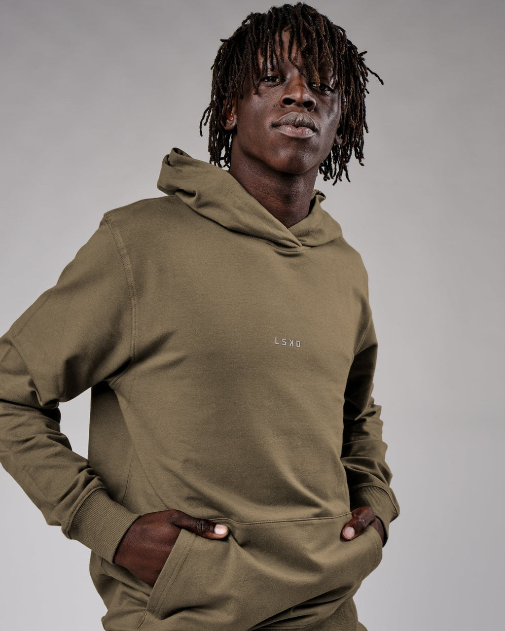 Model wearing Base Hoodie - Walnut Grey