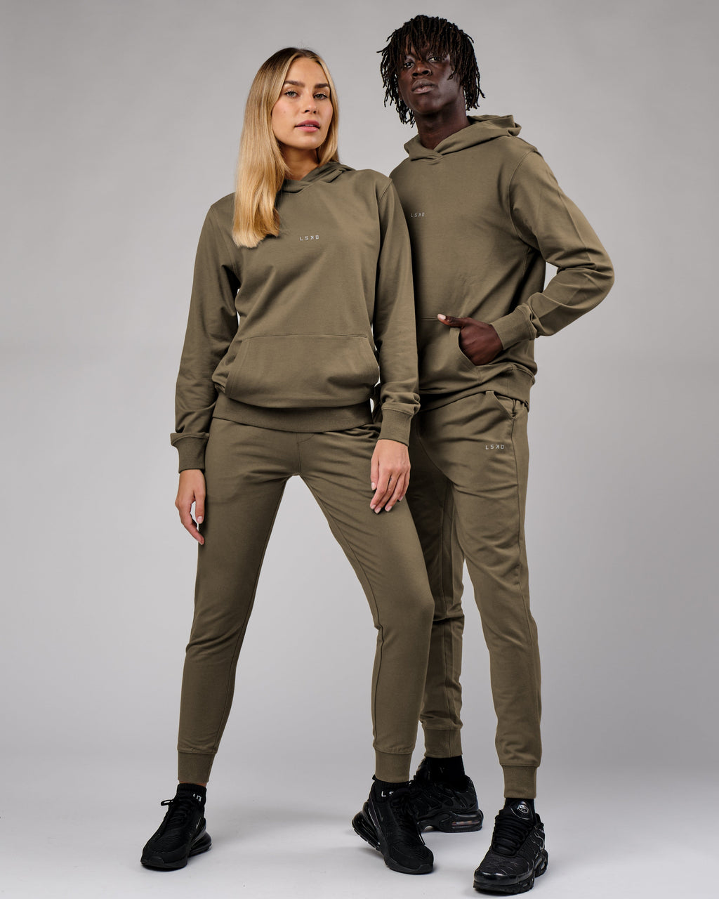 Model wearing Unisex Base Track Pant - Walnut Grey