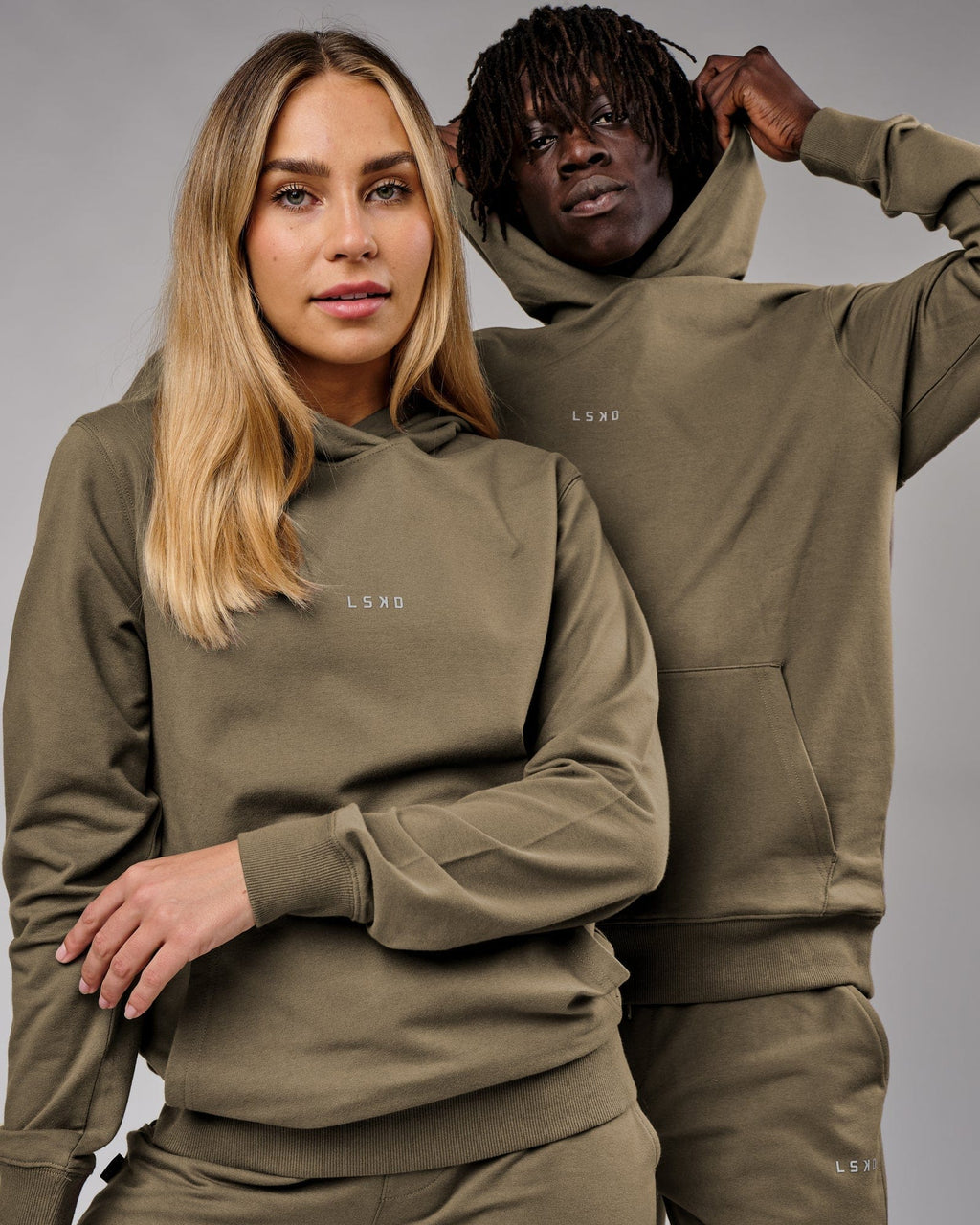 Model wearing Unisex Base Hoodie - Walnut Grey