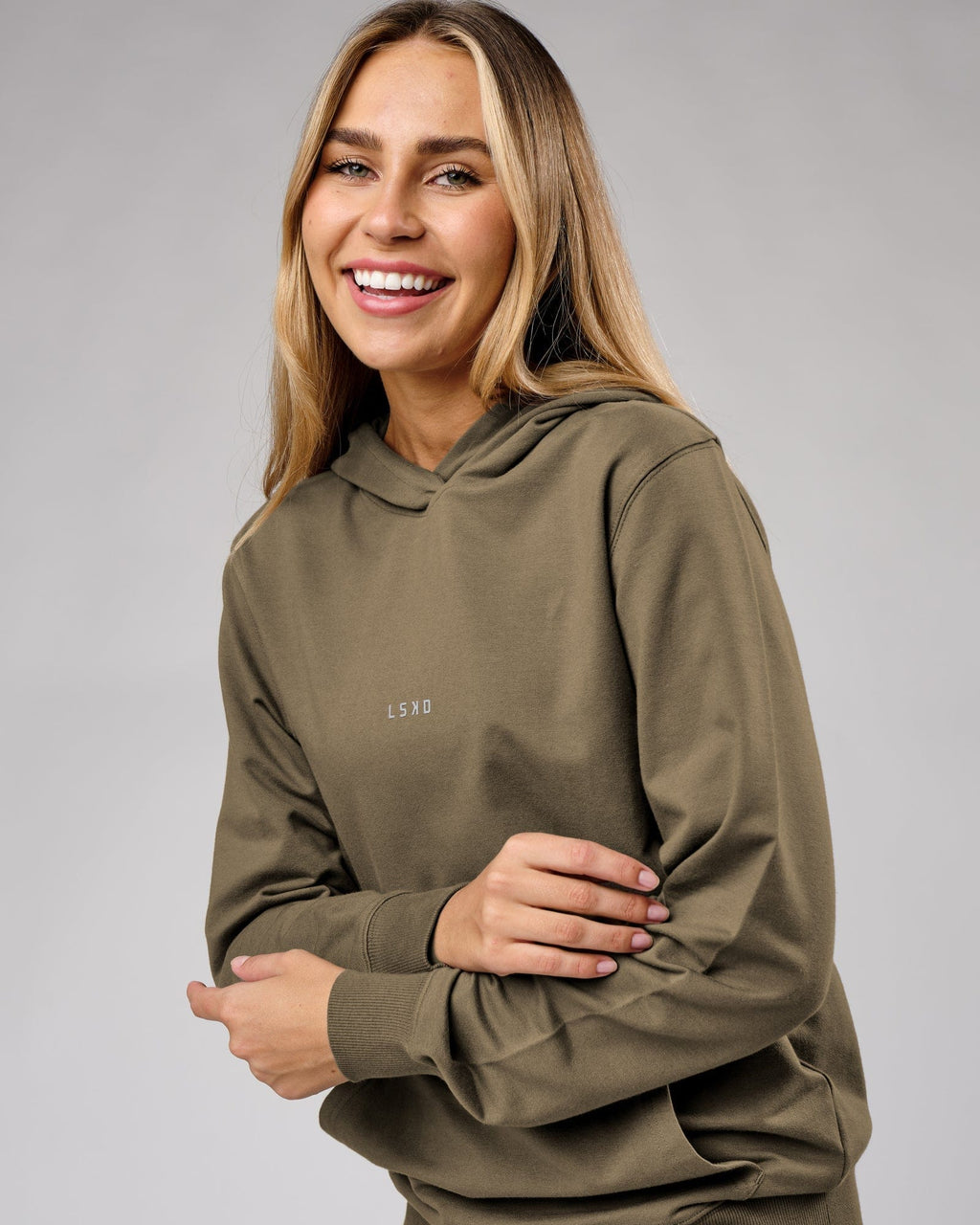 Model wearing Unisex Base Hoodie - Walnut Grey