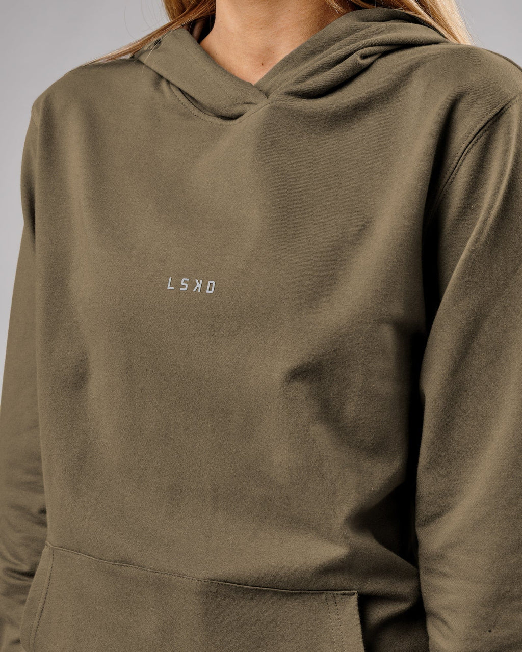 Model wearing Unisex Base Hoodie - Walnut Grey