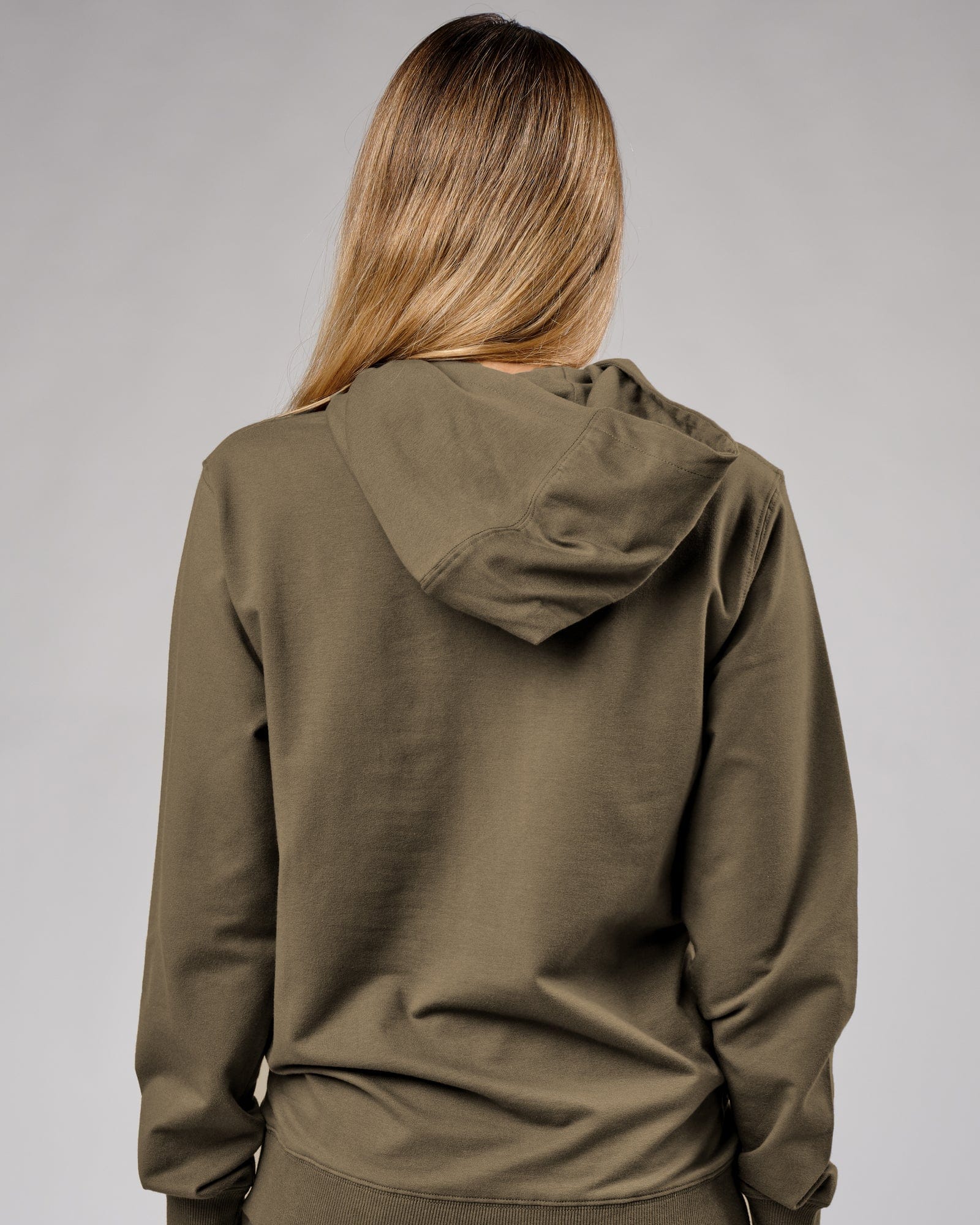 Model wearing Unisex Base Hoodie - Walnut Grey