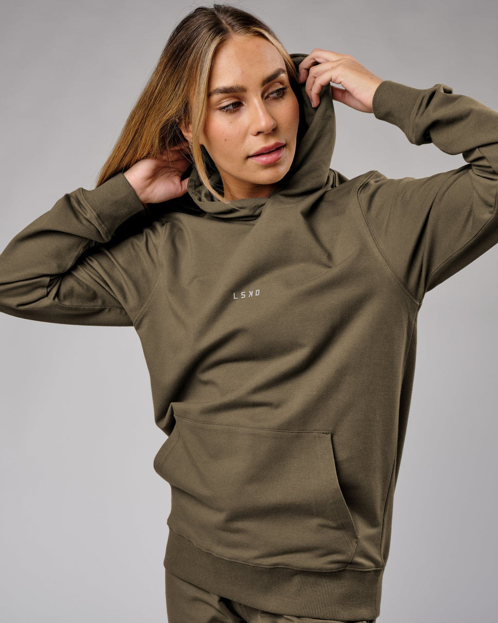 Model wearing Unisex Base Hoodie - Walnut Grey