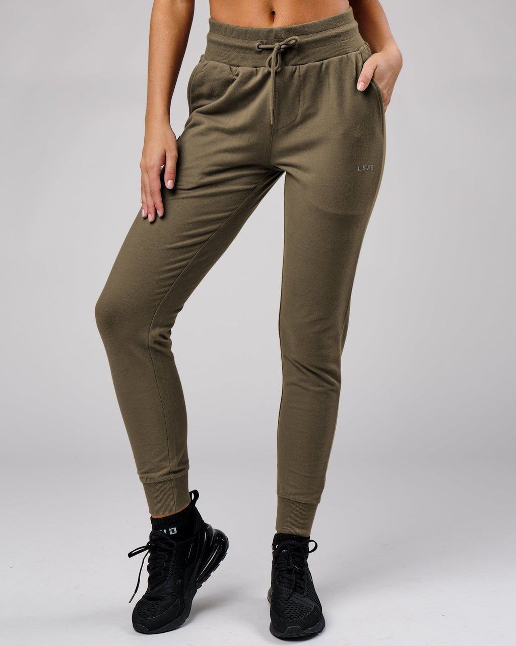 Model wearing Unisex Base Track Pant - Walnut Grey