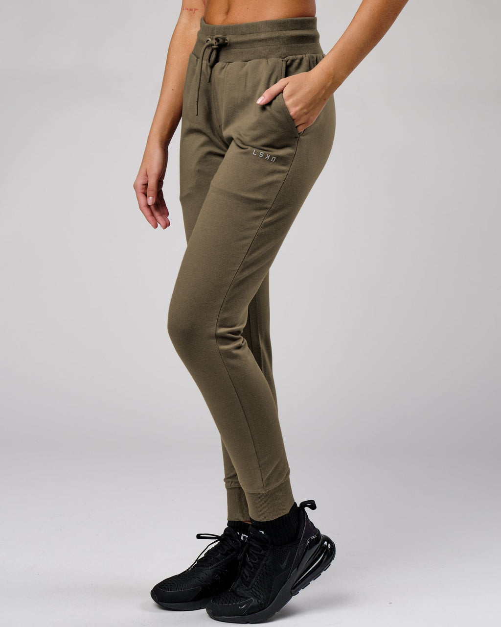 Model wearing Unisex Base Track Pant - Walnut Grey