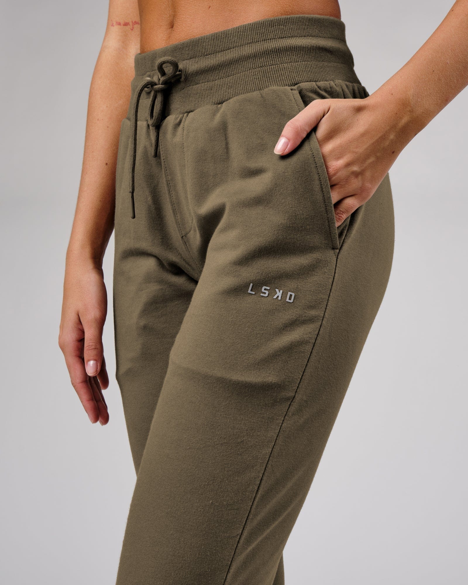 Model wearing Unisex Base Track Pant - Walnut Grey