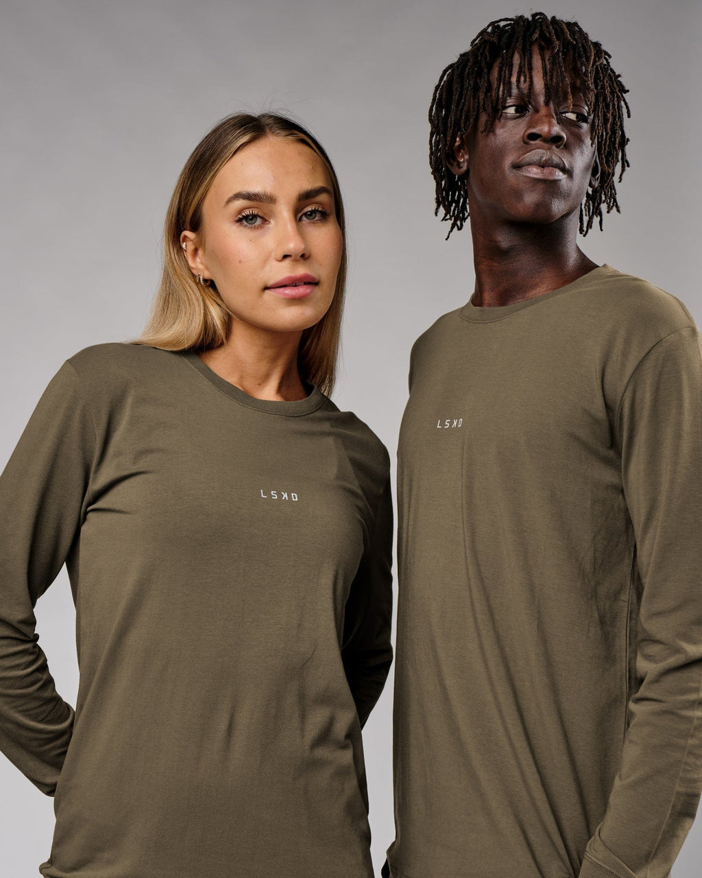 Model wearing Unisex Base LS Tee - Walnut Grey