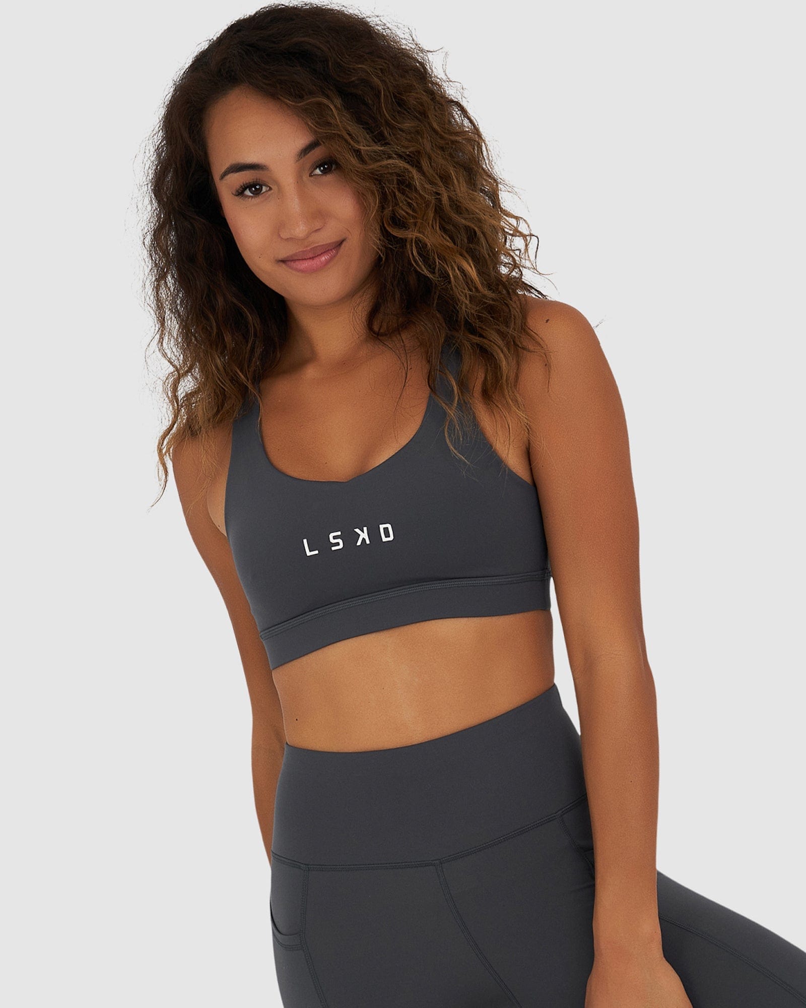 Model wearing Rep Sports Bra Small Logo - Turbulence