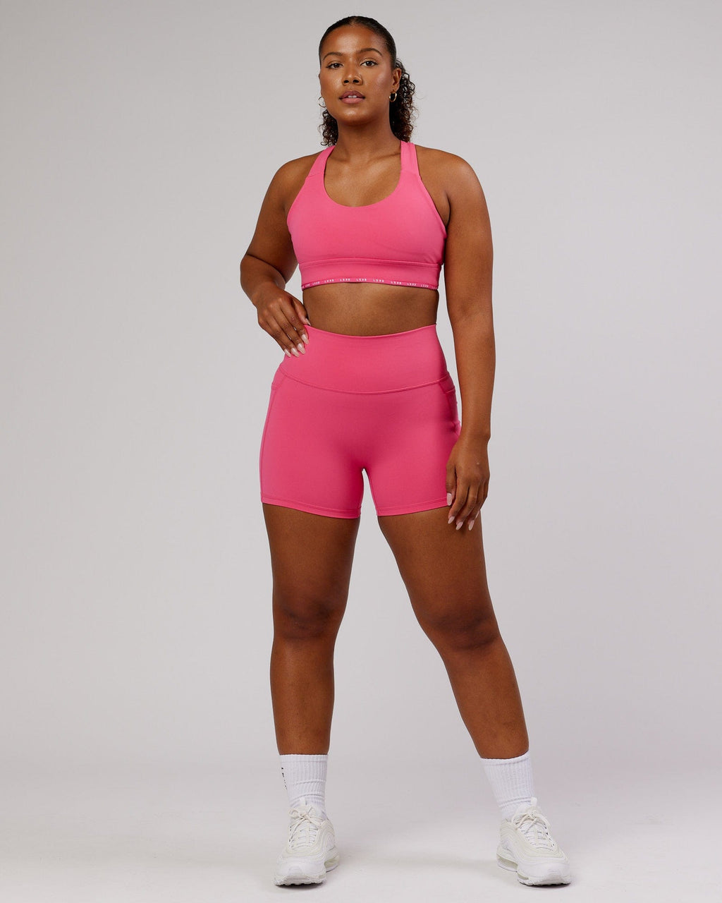 Model wearing MVP Sports Bra - Flamingo