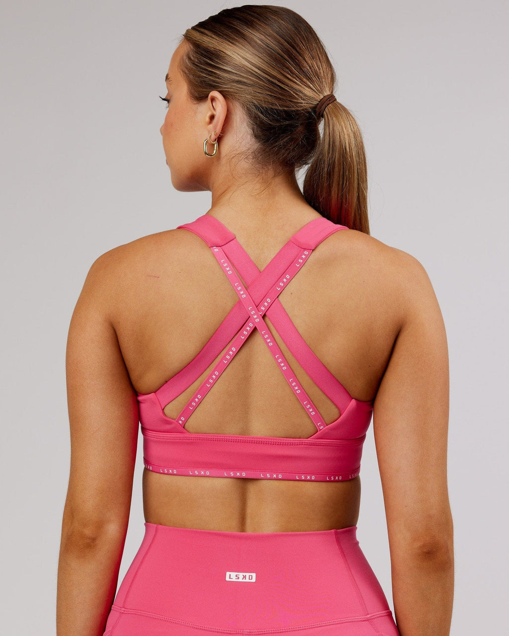 Model wearing MVP Sports Bra - Flamingo