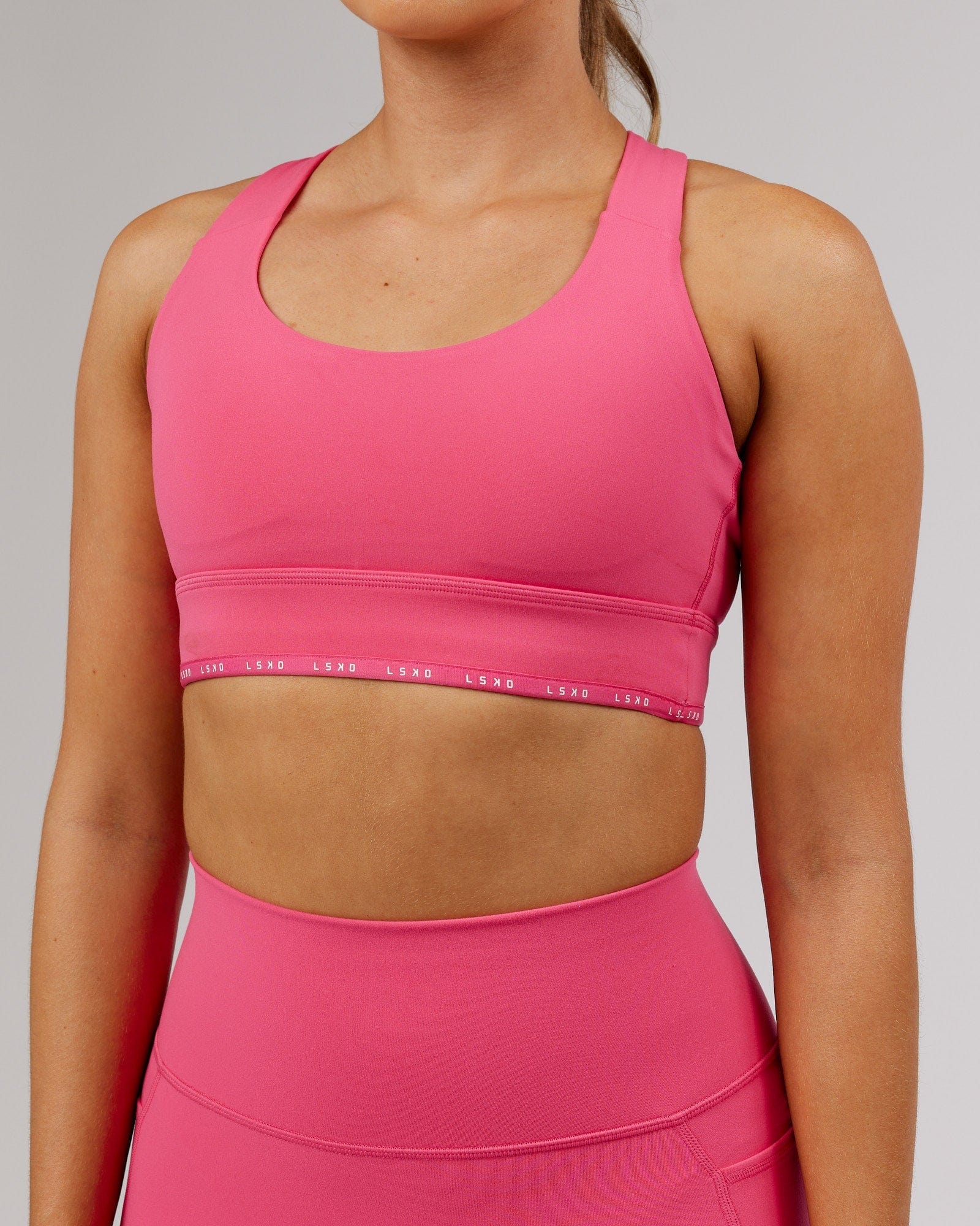 Model wearing MVP Sports Bra - Flamingo