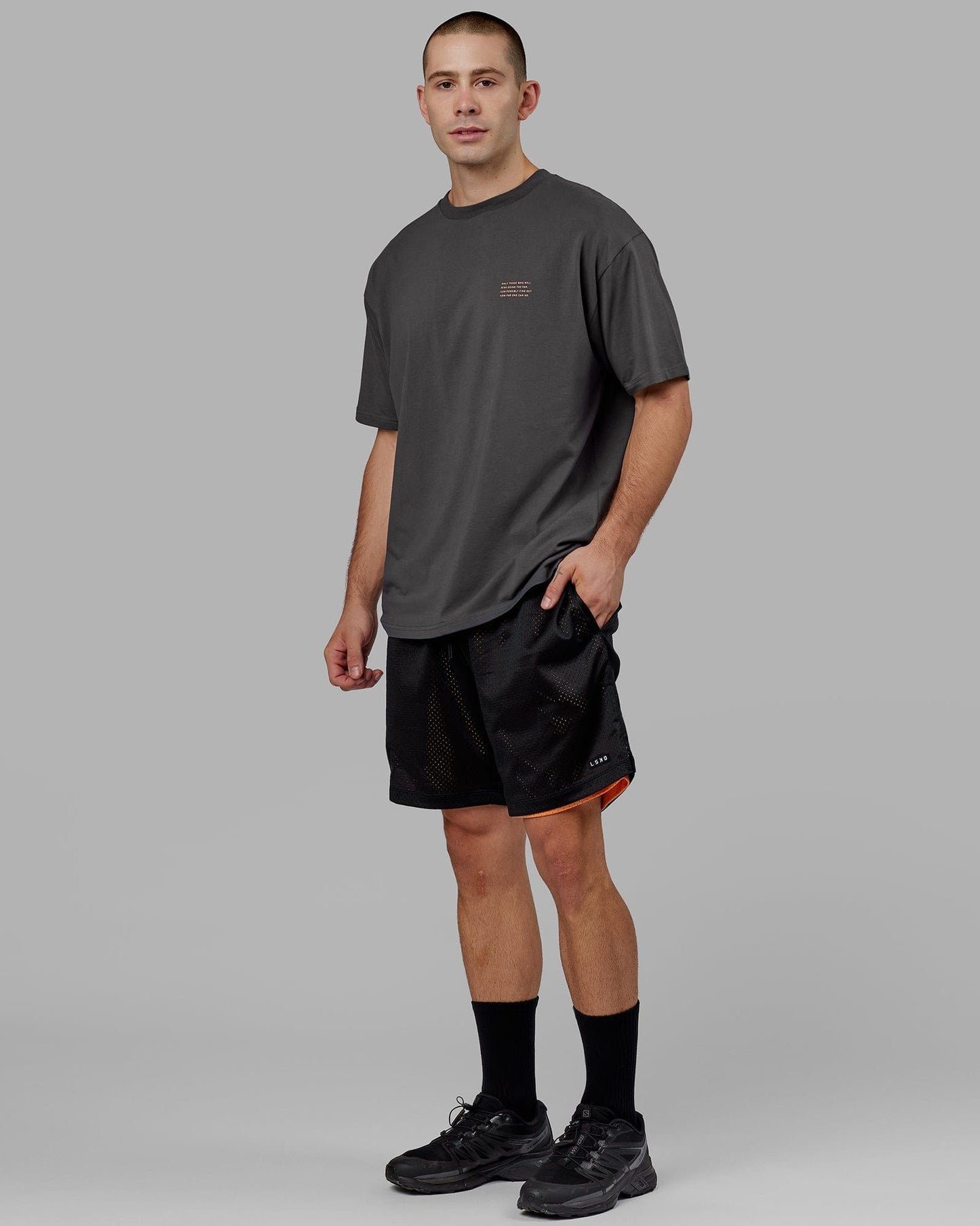 Model wearing Strive FLXCotton Tee Oversize - Asphalt-Tangerine