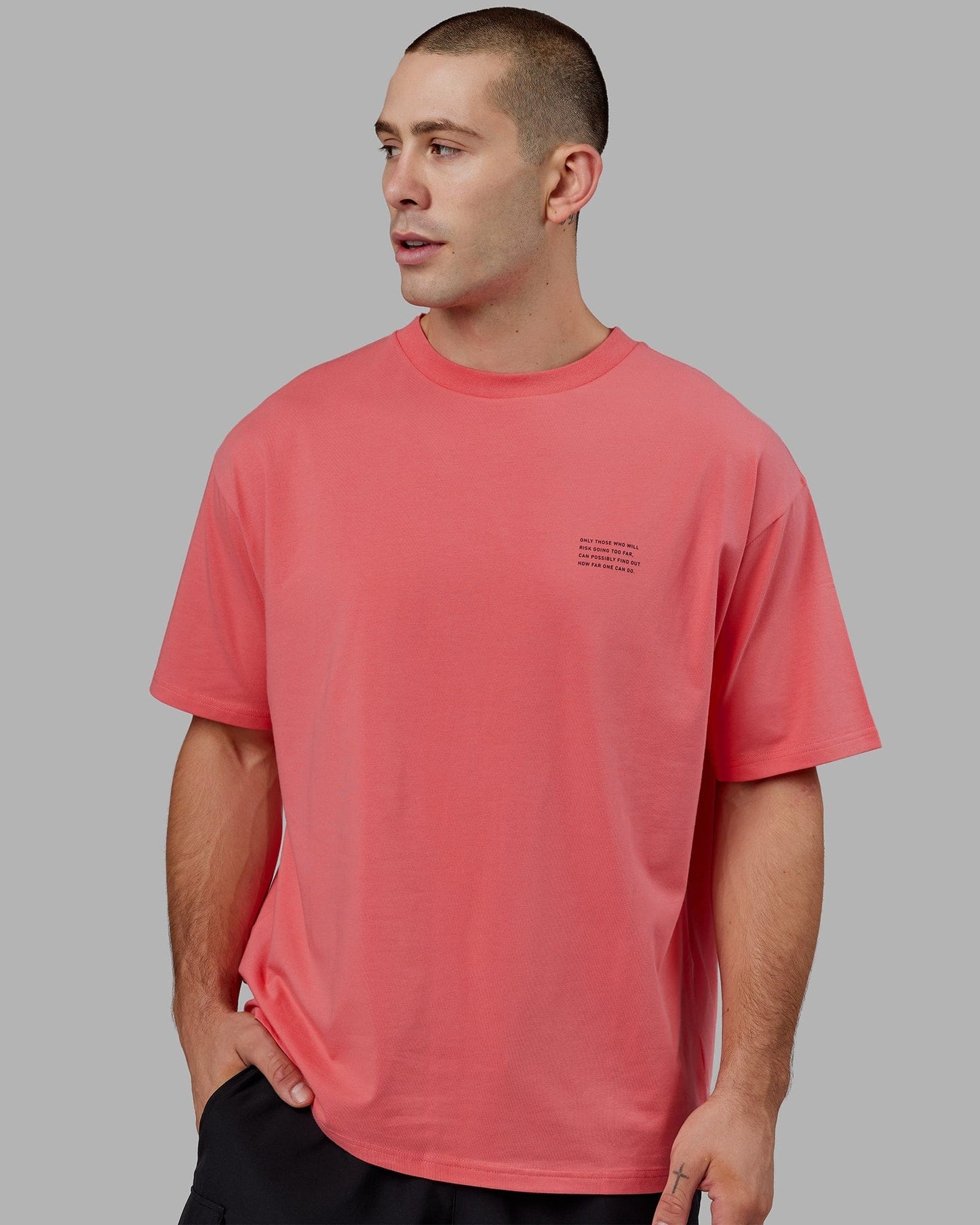 Model wearing Strive FLXCotton Tee Oversize - Sunkist Coral